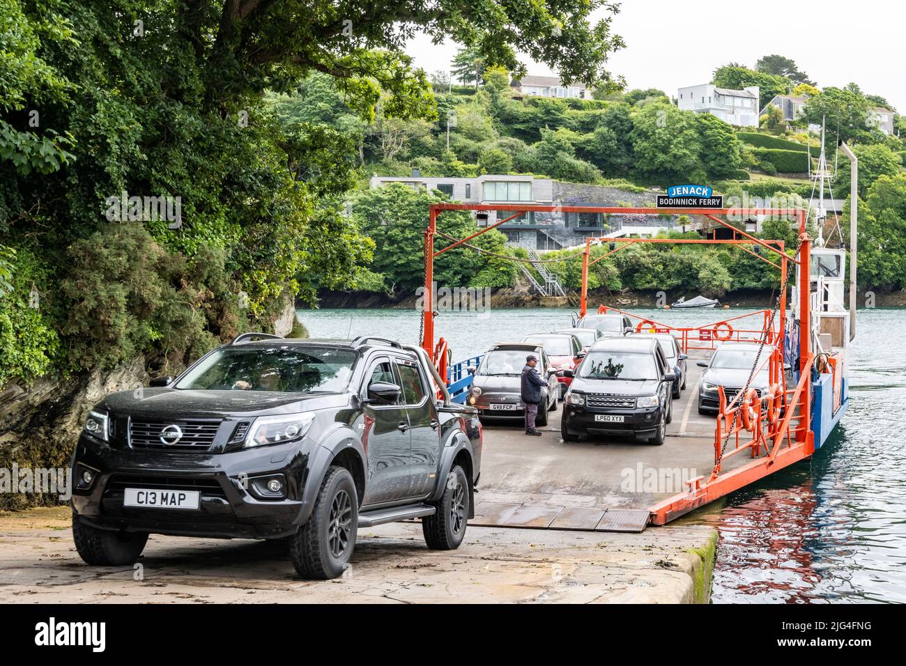 Car ferry. Cars leaving the Bodinnick ferry which crosses the river Fowey, connecting mid and east Cornwall. Fowey, Cornwall, UK Stock Photo