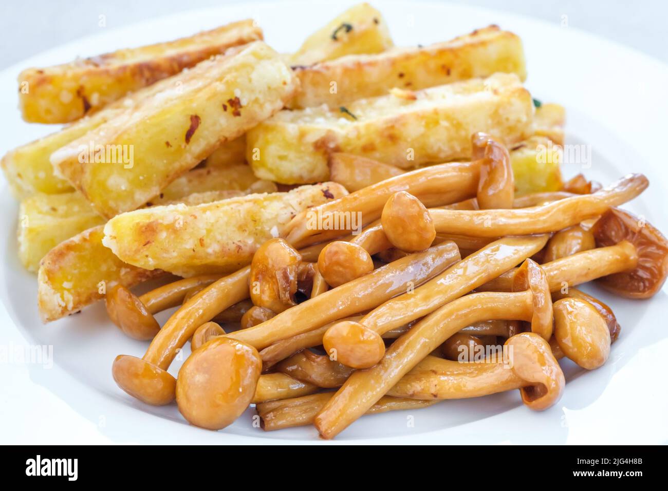 French fries with soy sauce shimeji mushrooms Stock Photo Alamy