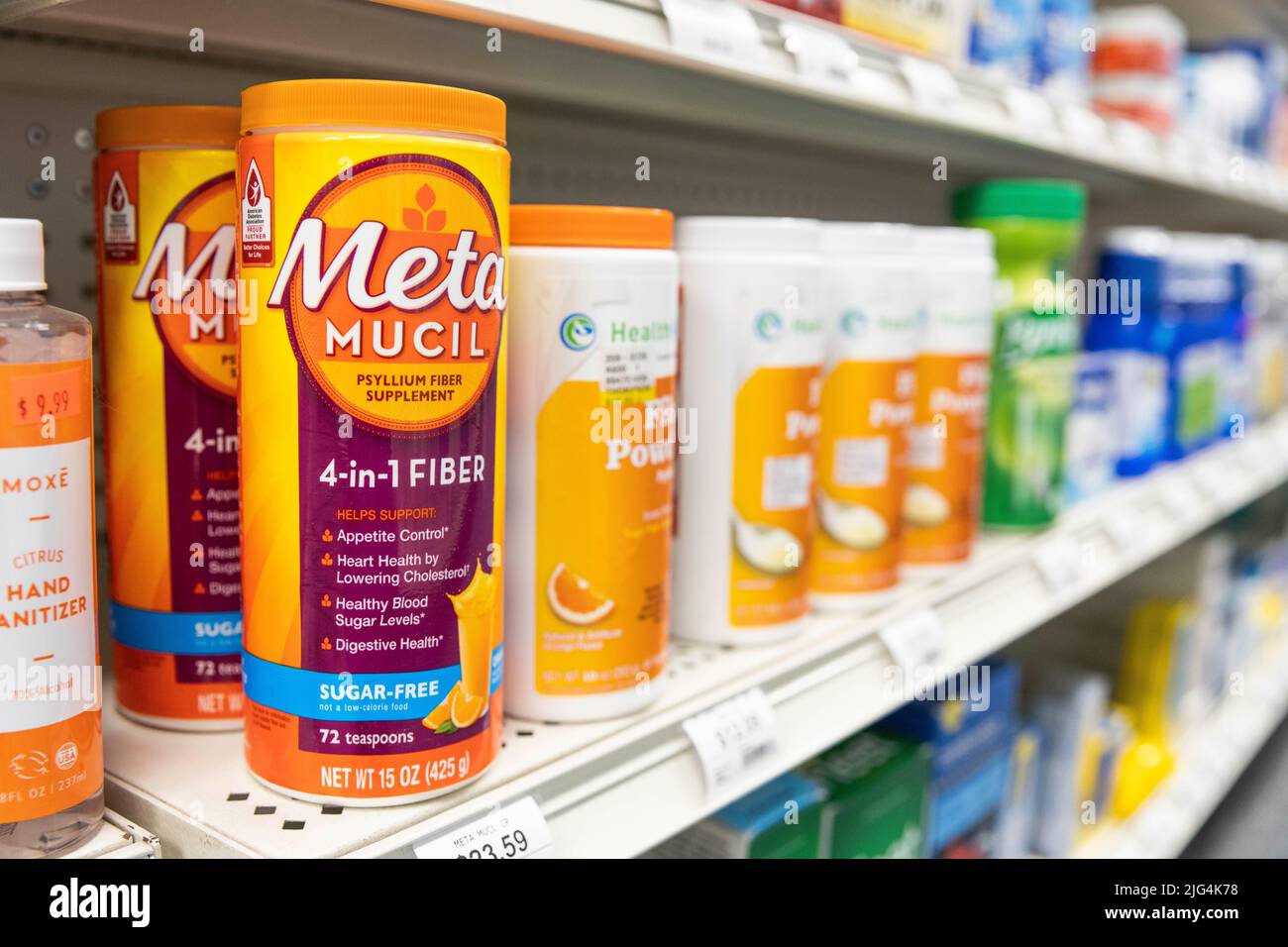 Containers of Metamucil brand fiber powder sit on drug store shelf Stock Photo