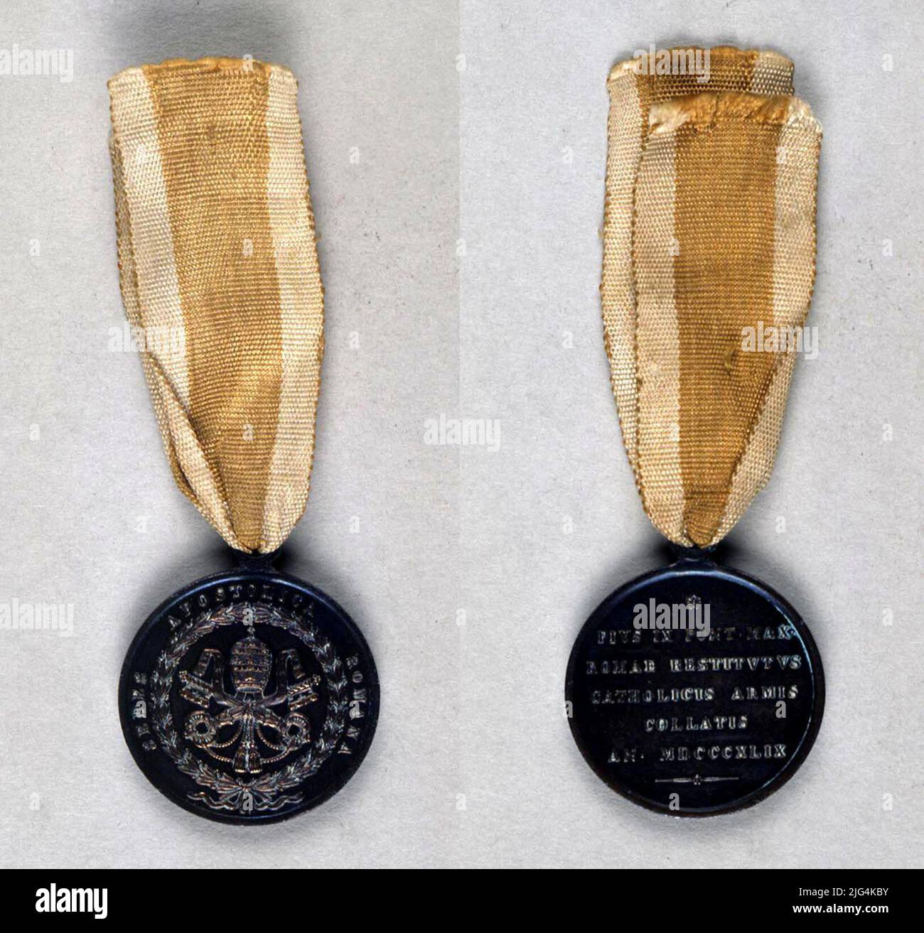 Commemorative medal of the expedition to Italy of 1849, Vatican. Commemorative Medal. Medal created by the Pontifical State, in categories of gold, silver and bronze to be granted as a distinction to the militias of Spain, Austria, France and Naples that with their intervention in Italy, made possible the return to Rome of S. Santity Pio Ix IX Circular form that is articulated by a solidarity hitch with it, located in its upper part, through which a yellow silk moaré tape passes with two white girdles, papacy symbols, located one to each side, of the which asss the medal. Circular, smooth and Stock Photo