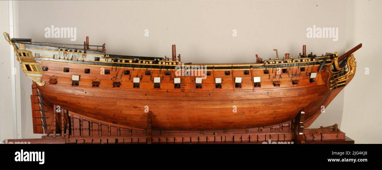 Model is longitudinal section of a ship of 68 cannons. Longitudinal section Model boat. Construction units: Ribera elbows. Equivalent dimensions of the ship: Traced Leather 74.1 Cubits (42.59 m), Mail Length 63.5 Cubits (36.49 m), Manga in 1st cover 20.67 elbows (1.88 m) Armament: 68 cannons Distributed surely according to the regulation of 1728. First battery 15 cannons per band; Second battery 14 cannons per band; Alcázar 3 cannons per band, Castillo 1 per band; Two guards. The model represents a ship of 68 guns cut by the creak, which allows you to see all the interior compartmentalization Stock Photo