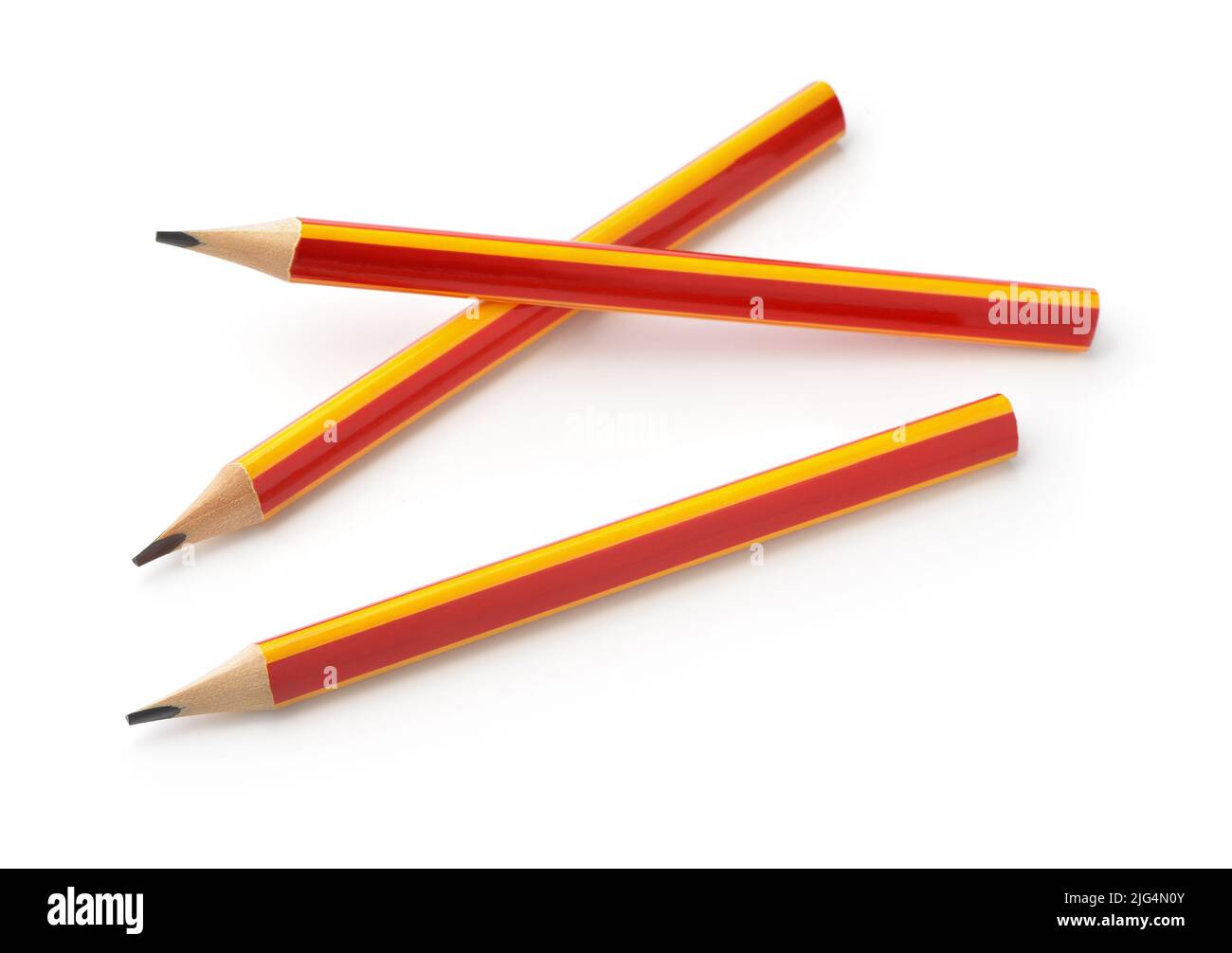 Three red and yellow graphite pencils isolated on white Stock Photo