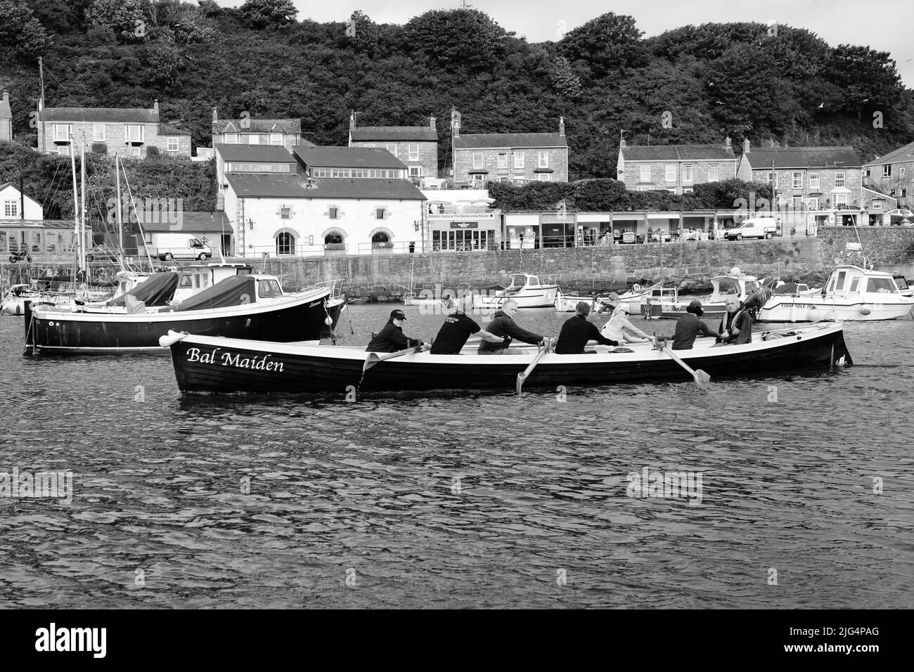 Bal Maiden Pilot Gig leaves Porthleven, Cornwall on a training run Stock Photo