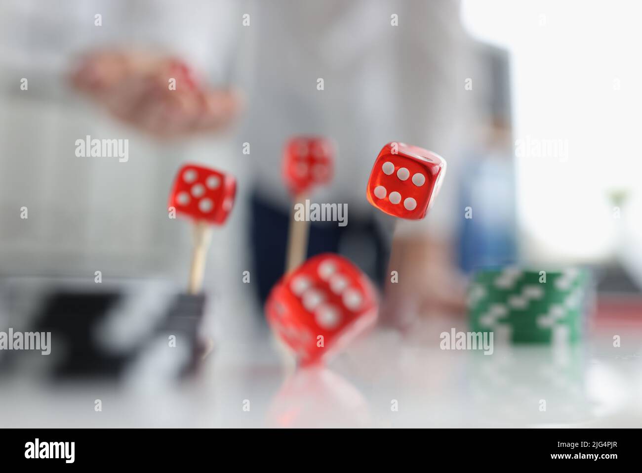 Closeup of person throwing dice. Addiction to gambling concept Stock