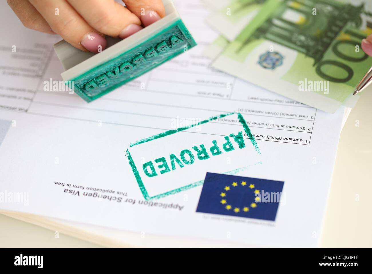 Approved EU visa application and cash euro banknotes Stock Photo Alamy
