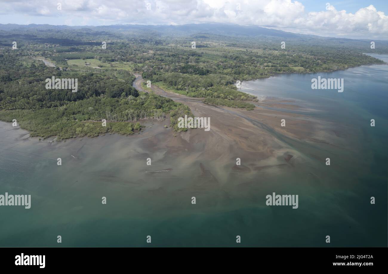 Aerial view of river mouthshowing delta with sediment build up Pacific coast of southern Costa Rica,             March Stock Photo