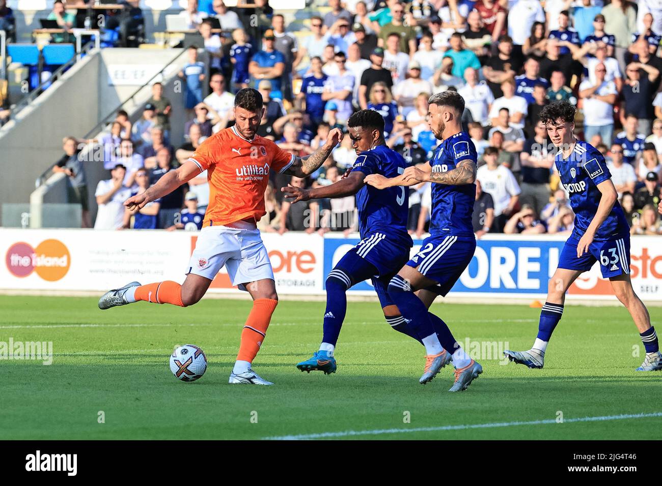 Gary Madine #14 of Blackpool shoots on goal, blocked by Junior Firpo #3 of Leeds United Stock Photo
