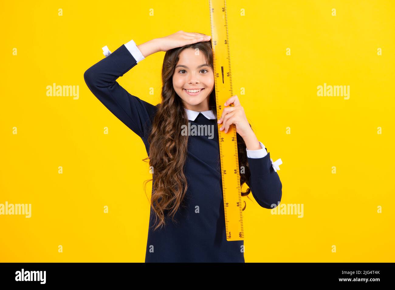 Teenager school girl study math or geometry lesson, measure the size ...