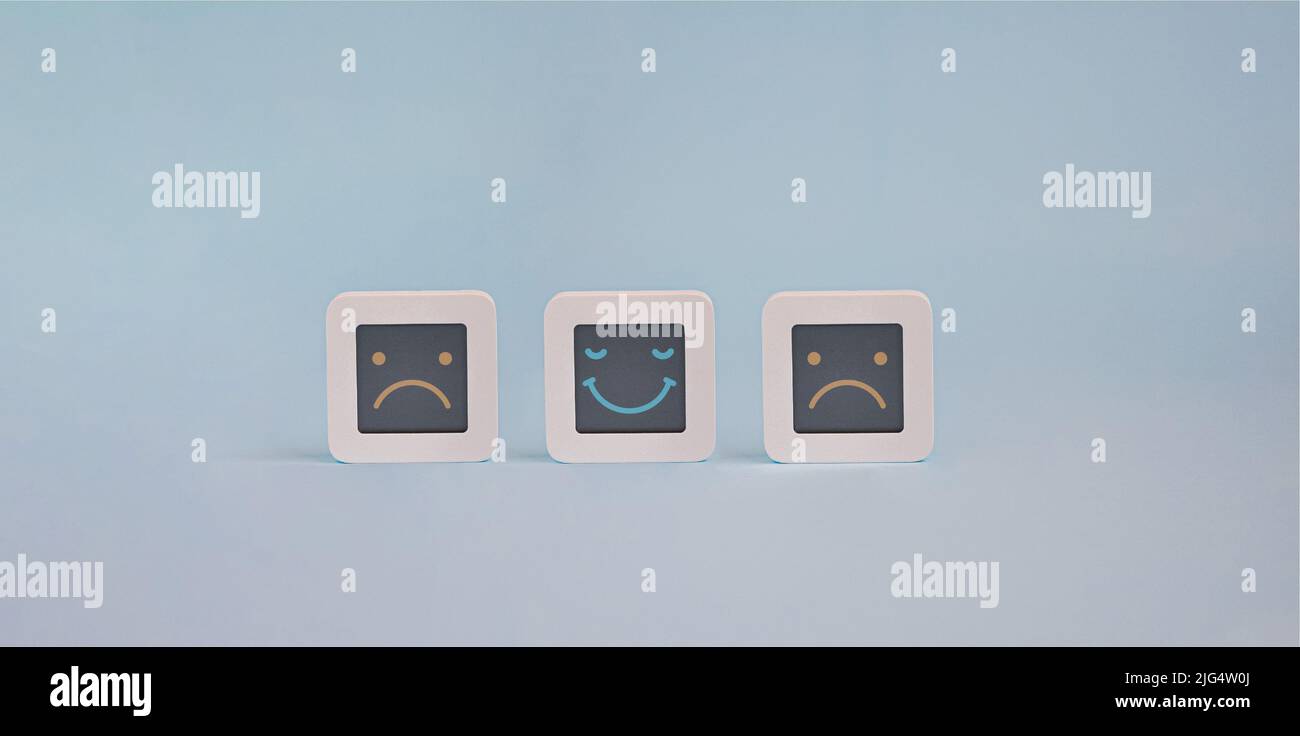 Set of computers with stylized faces of happy and sad faces on lcd ...