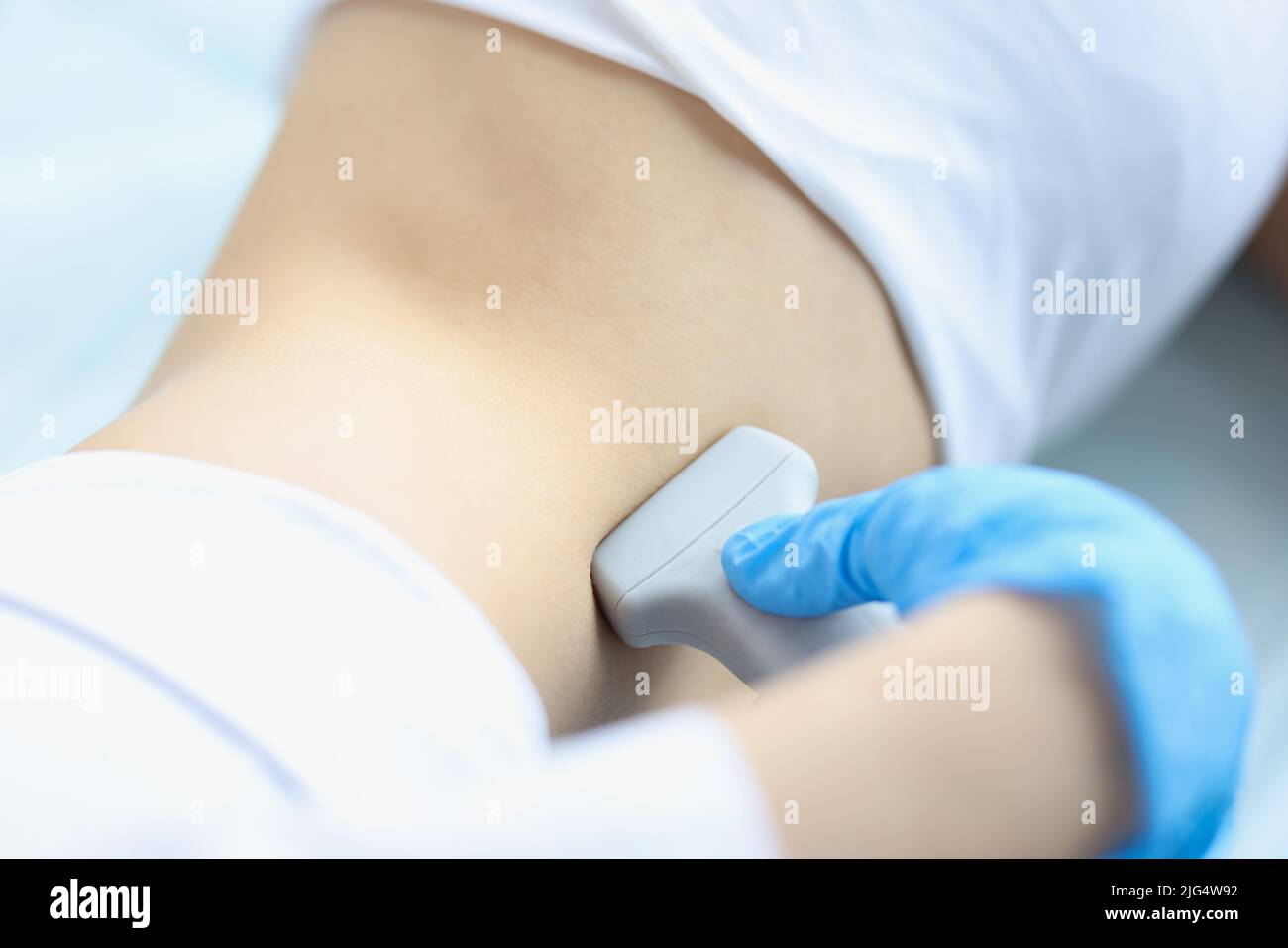 Doctor makes ultrasound diagnosis of patient with kidney prolapse Stock Photo