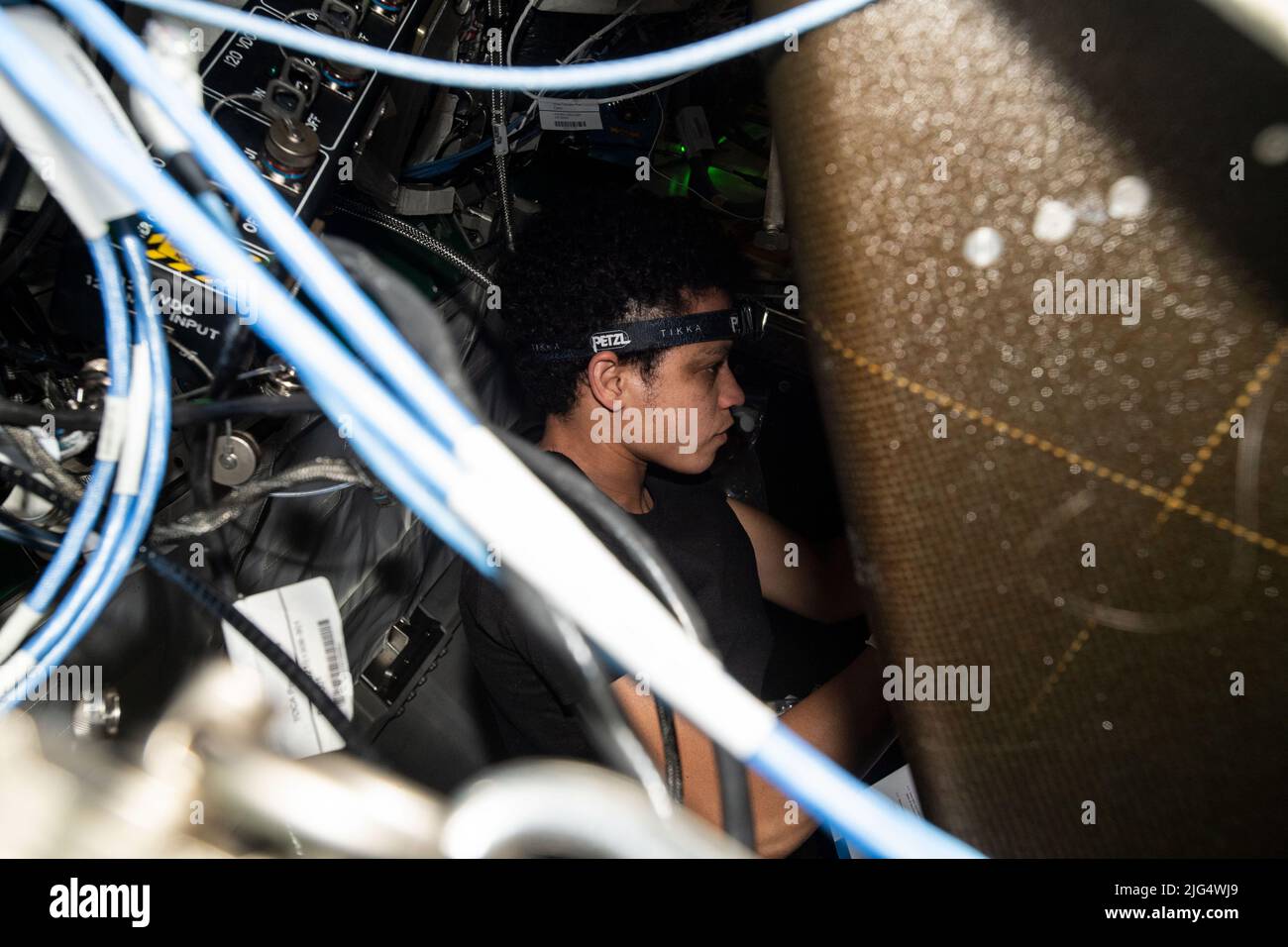NASA Expedition 67 Flight Engineer Jessica Watkins performs maintenance inside the Tranquility module Waste and Recycling System aboard the International Space Station, June 1, 2022 in Earth Orbit. Stock Photo