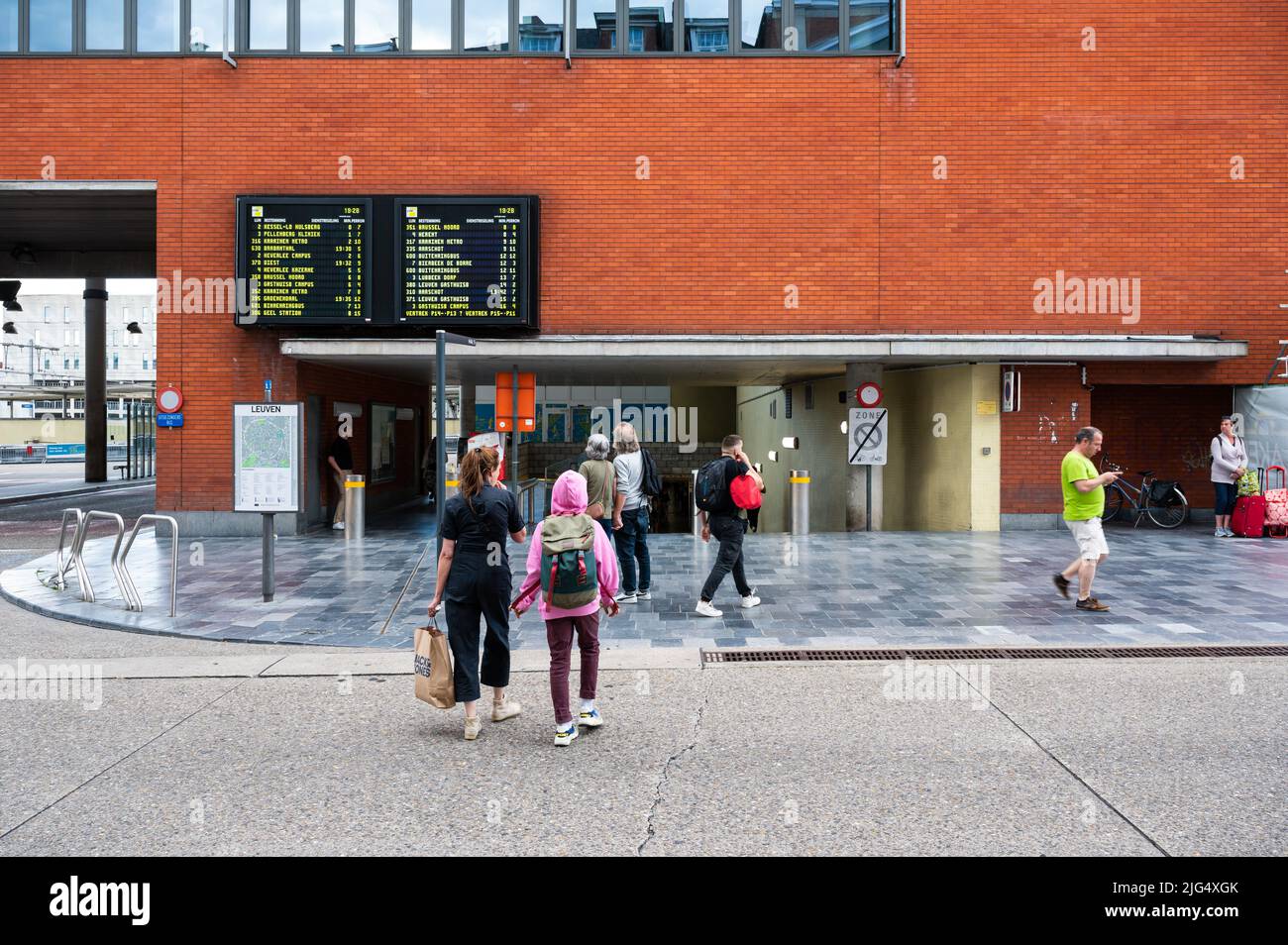 Leuven, Flemish Brabant Region, Belgium - 07 01 2022 - Travellers at the entrance of the main railway station Stock Photo