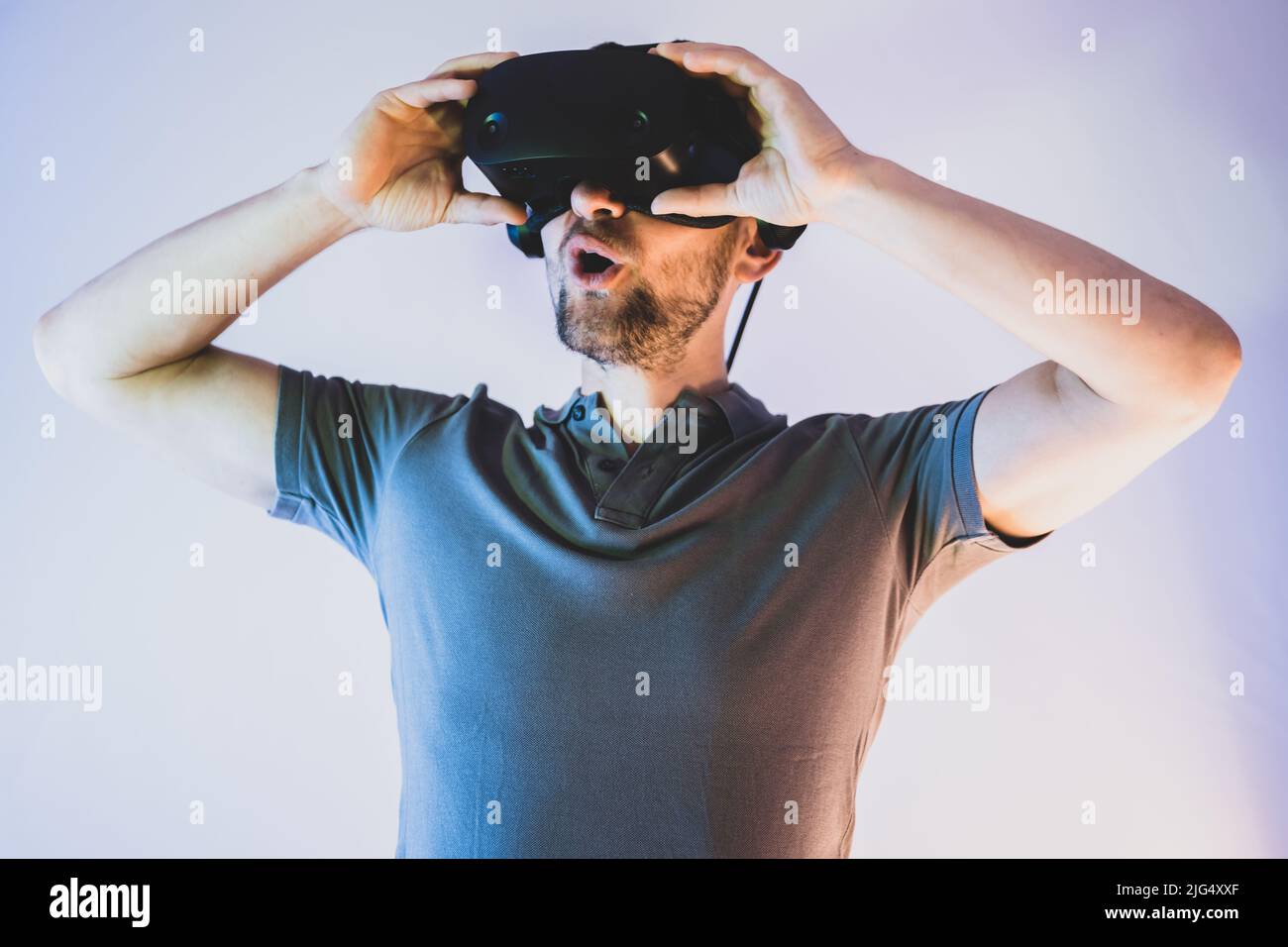 A man is amazed by virtual reality impressions Stock Photo - Alamy