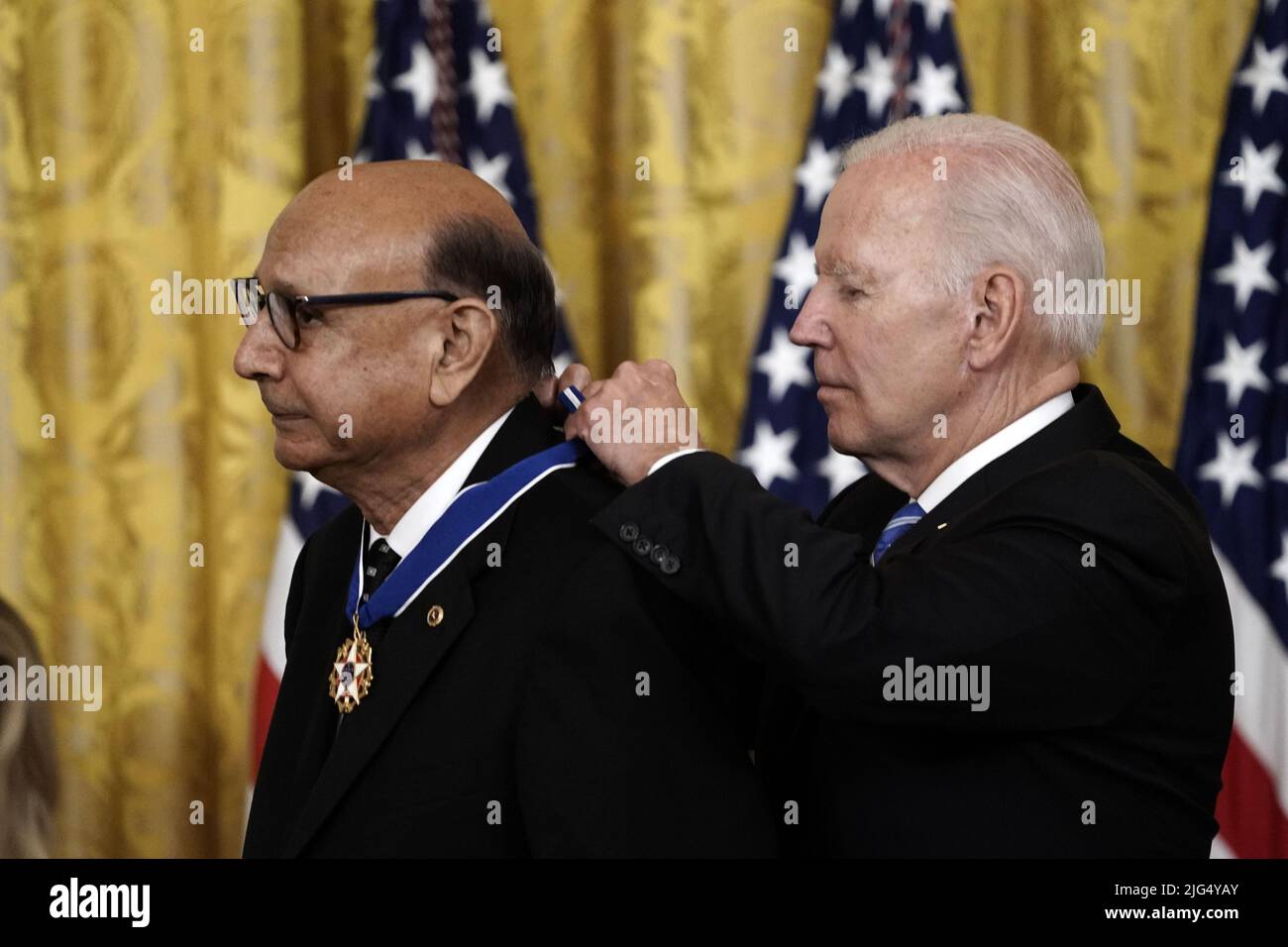 Washington, United States. 07th July, 2022. U.S. President Joe Biden awards the Presidential Medal of Freedom to Father Alexander Karloutsos, former Vicar General of the Greek Orthodox Archdiocese of America, and sixteen other recipients in the East Room of the White House in Washington, DC on Thursday, July 7, 2022. Photo by Ken Cedeno/UPI Credit: UPI/Alamy Live News Stock Photo