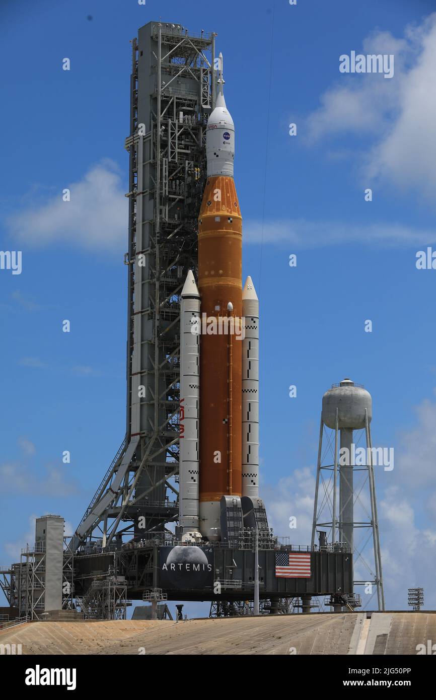 The NASA Artemis I Space Launch System rocket with the Orion spacecraft aboard is rolled out atop a mobile launcher at Launch Complex 39B, at the Kennedy Space Center, June 30, 2022, in Cape Canaveral, Florida. The SLS and Orion were transported to the pad on crawler-transporter 2 for a prelaunch test called a wet dress rehearsal. Stock Photo