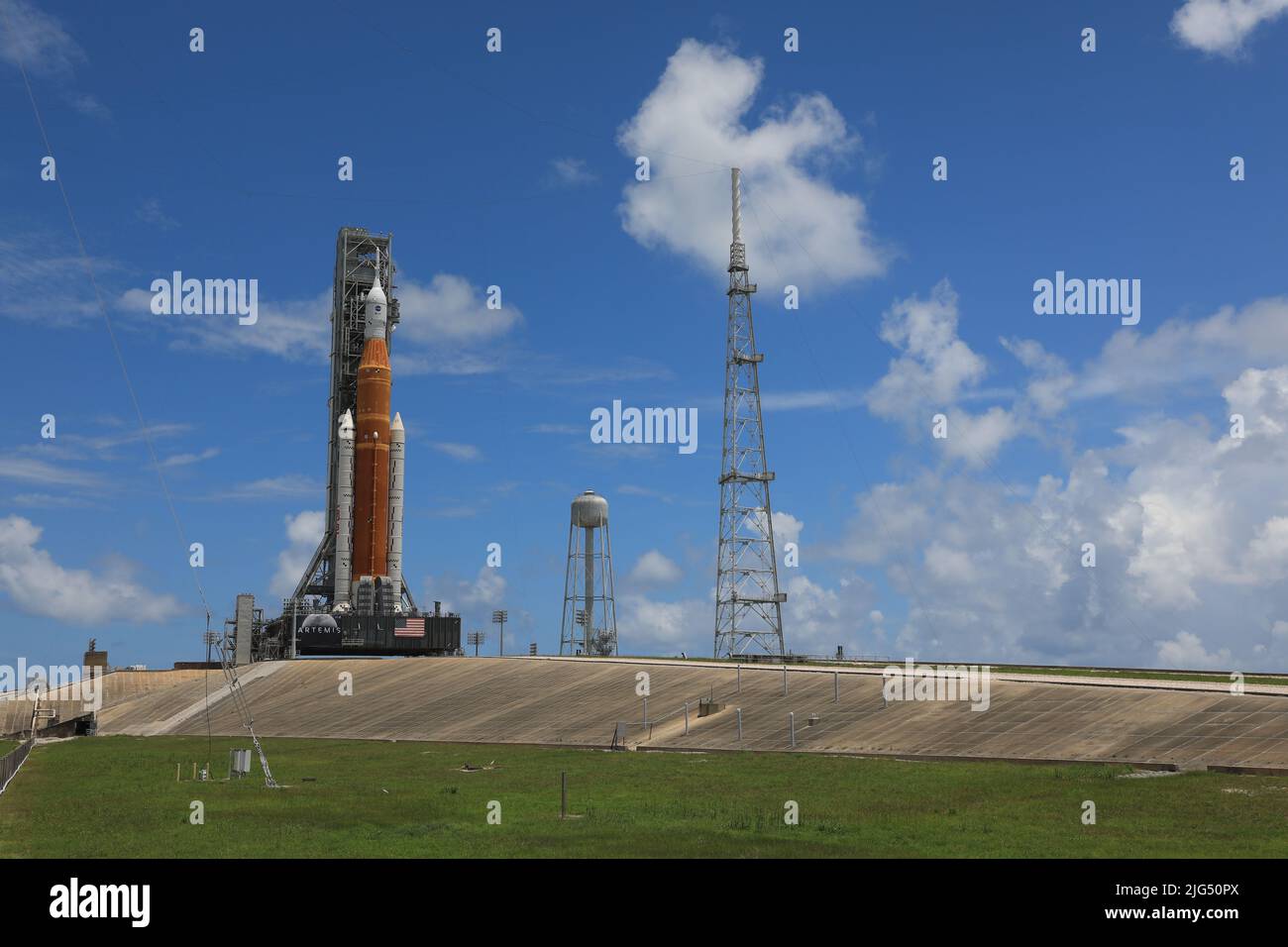 The NASA Artemis I Space Launch System rocket with the Orion spacecraft aboard is rolled out atop a mobile launcher at Launch Complex 39B, at the Kennedy Space Center, June 30, 2022, in Cape Canaveral, Florida. The SLS and Orion were transported to the pad on crawler-transporter 2 for a prelaunch test called a wet dress rehearsal. Stock Photo