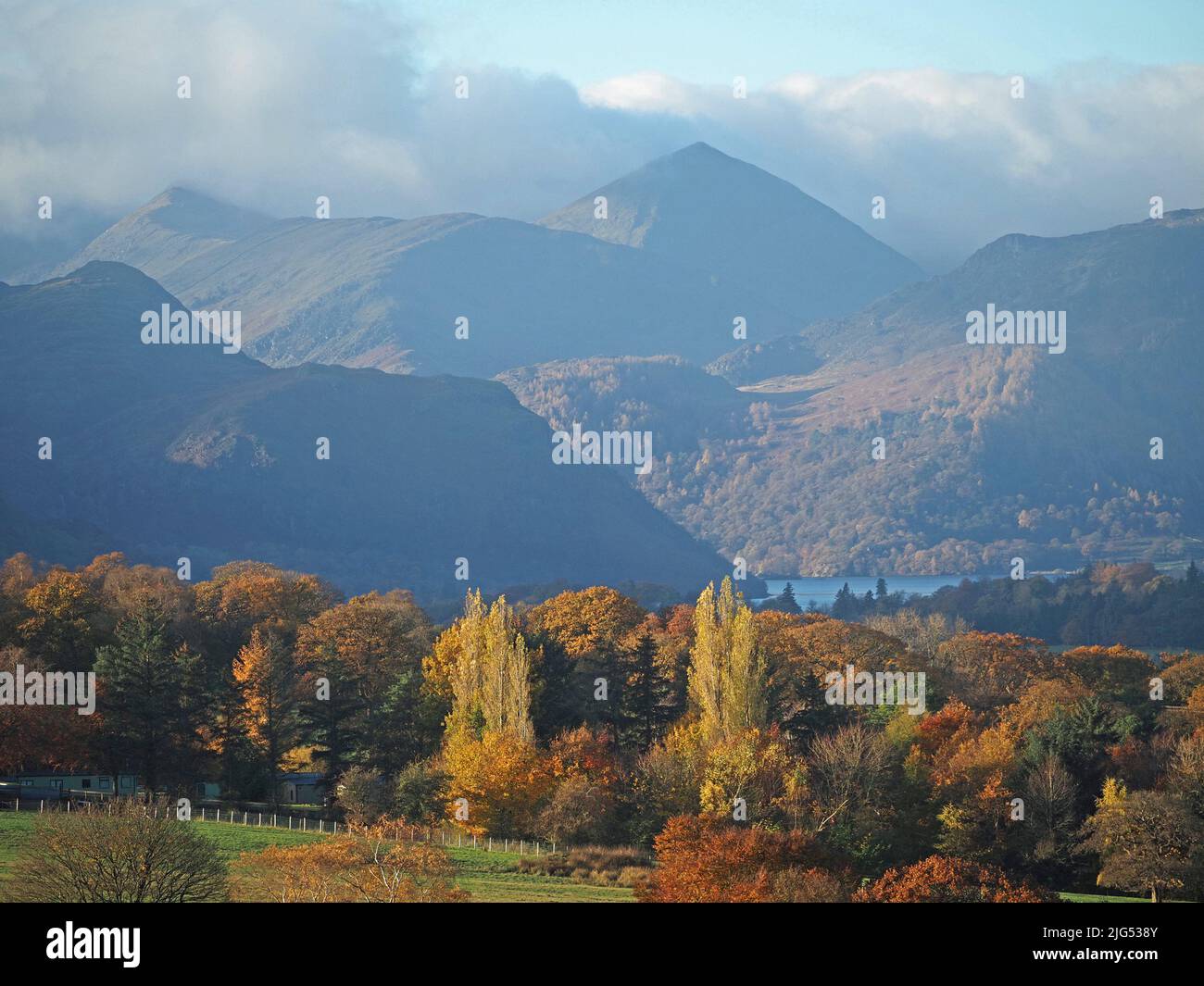 Autumn view from Ridding Brow above Pooley Bridge across Ullswater with lakeland hills in background - Cumbria, England, UK Stock Photo