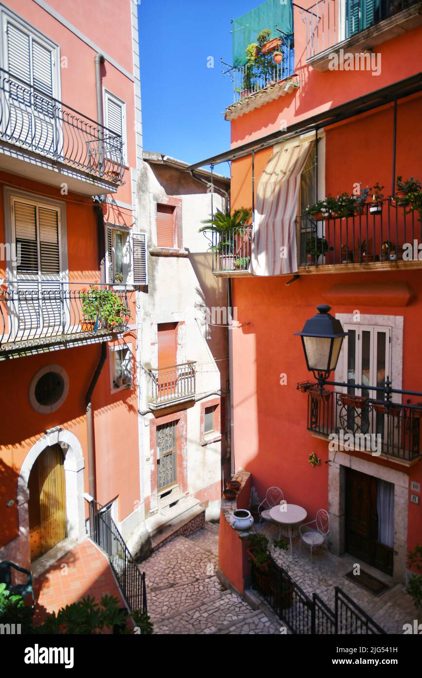 A narrow street between the old houses of Guardia Sanframondi, a