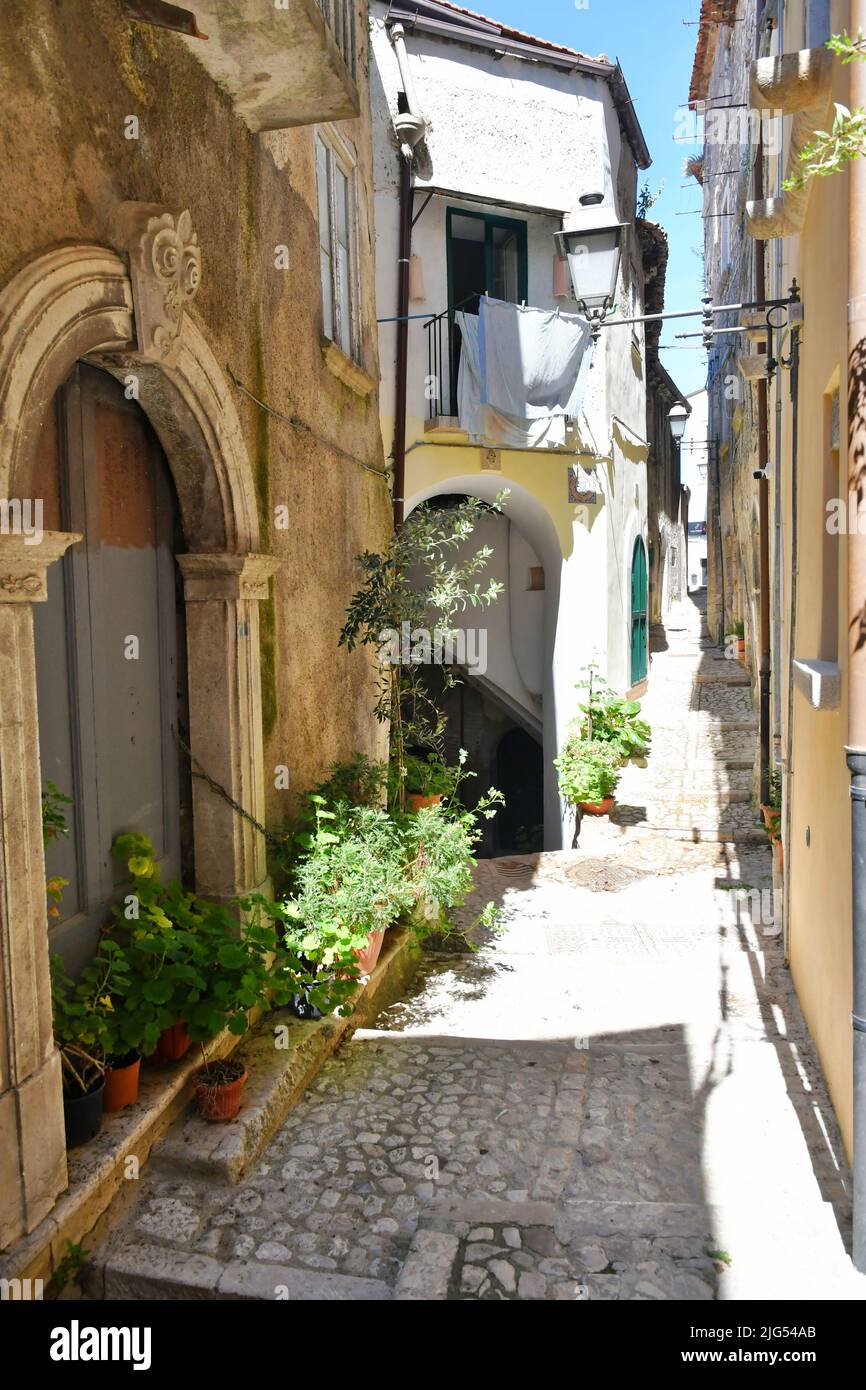 A narrow street between the old houses of Guardia Sanframondi, a