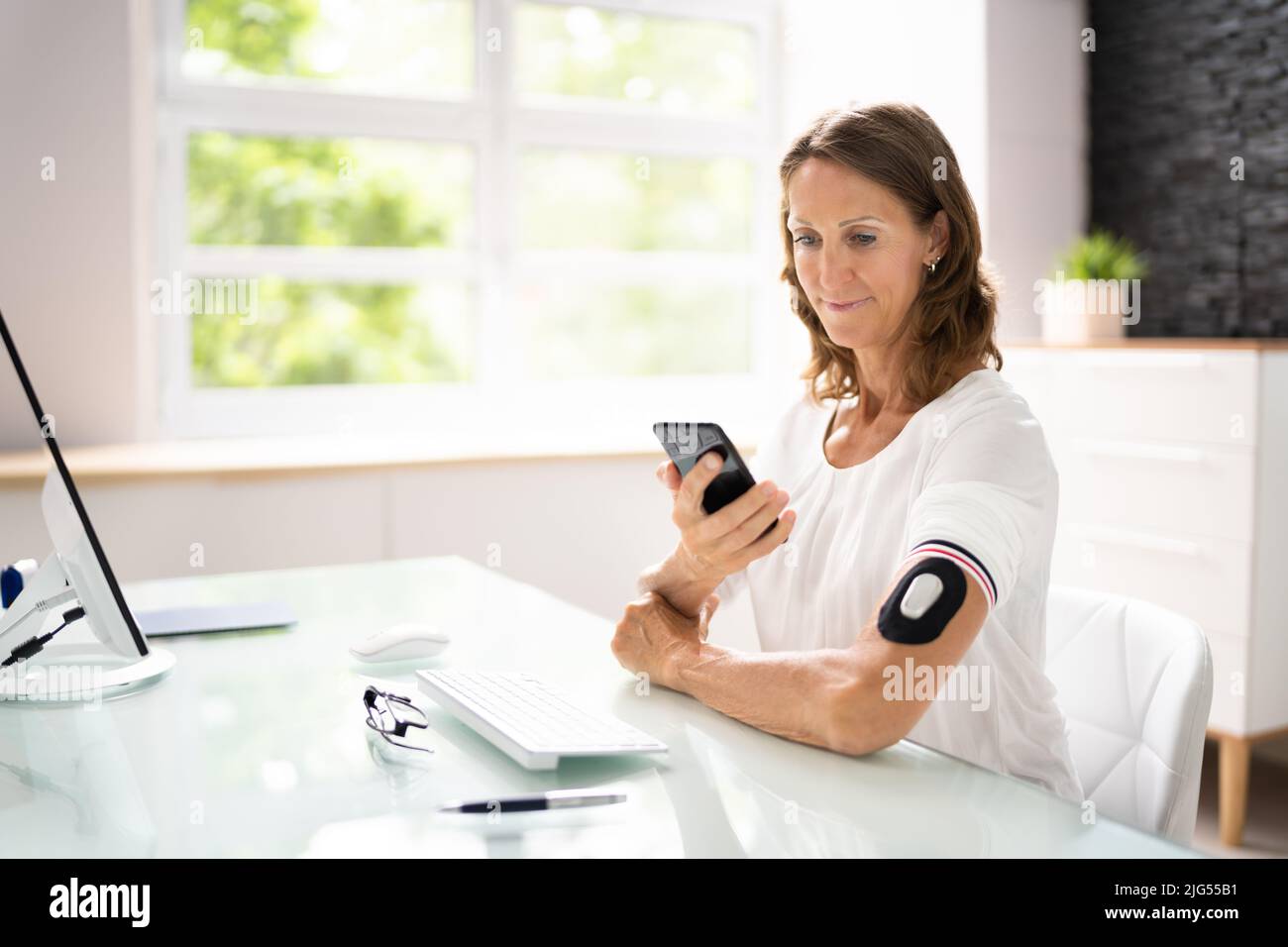 Continuous Glucose Blood Check Using Smartphone. Patient With Diabetes