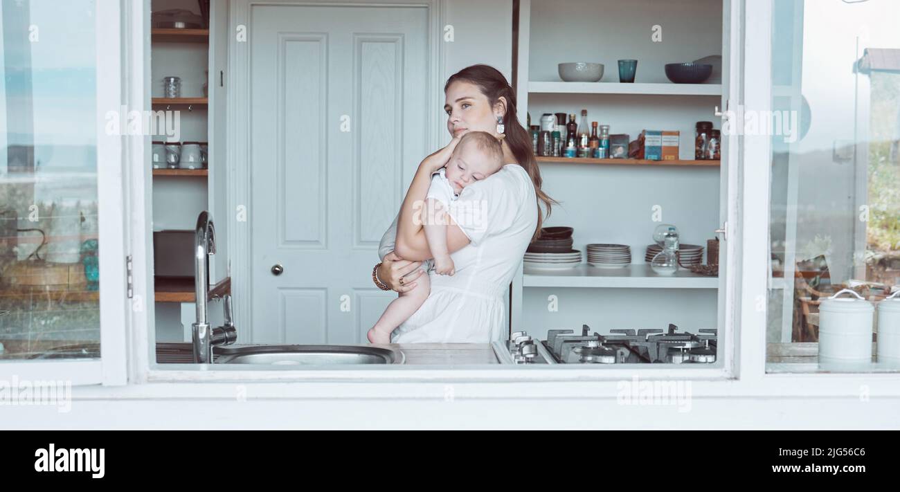 Her arms will never tire of holding him. Shot of a beautiful young mother bonding with her newborn at home. Stock Photo