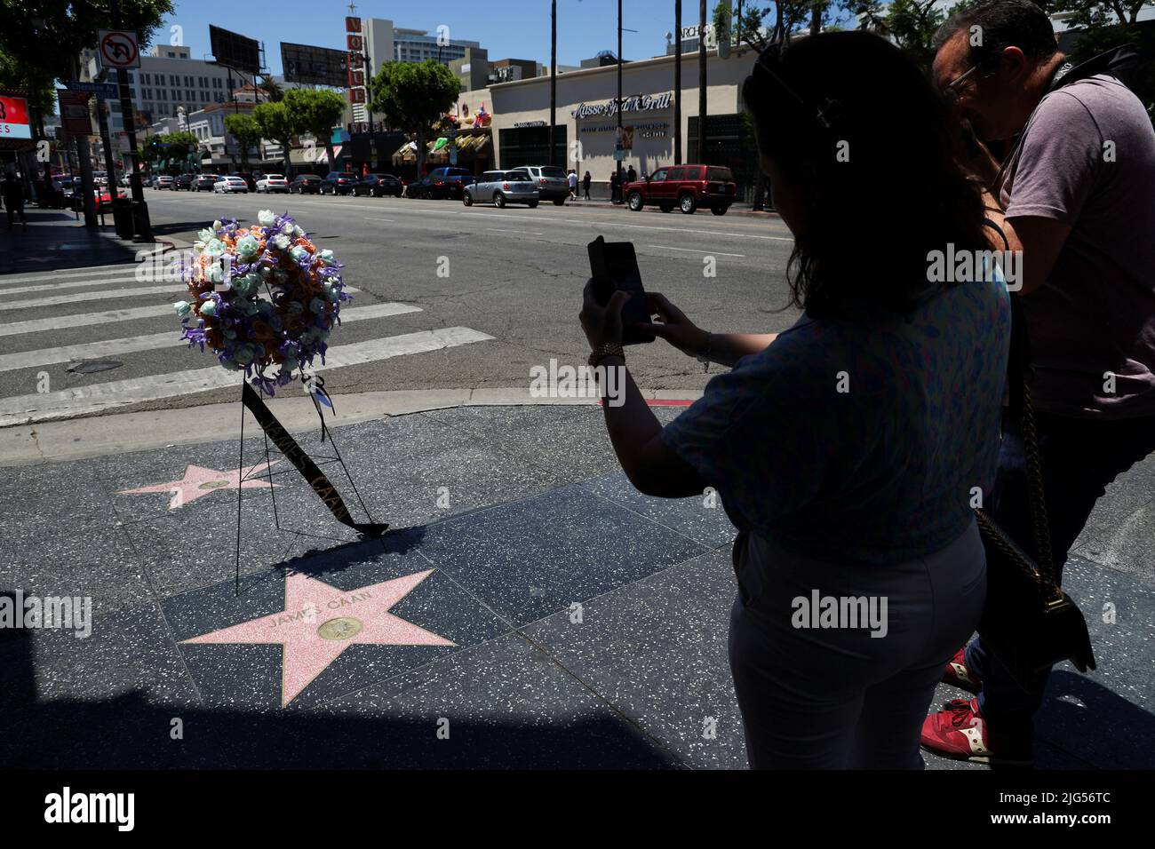People take pictures of the late actor James Caan's star on the Hollywood Walk of Fame, Los Angeles, California, U.S., July 7, 2022 REUTERS/Mario Anzuoni Stock Photo