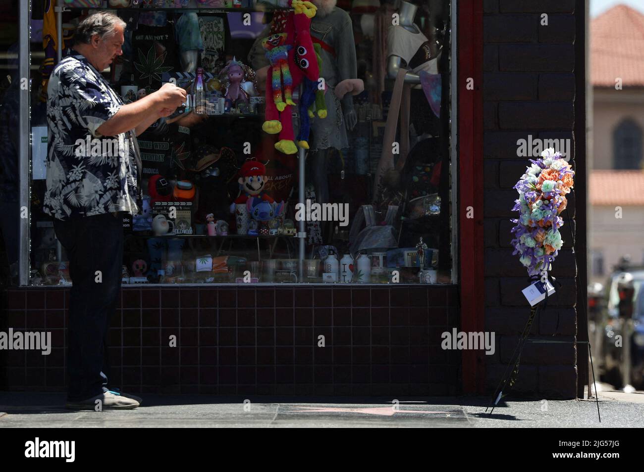 A man takes pictures of the late actor James Caan's star on the Hollywood Walk of Fame, Los Angeles, California, U.S., July 7, 2022 REUTERS/Mario Anzuoni Stock Photo