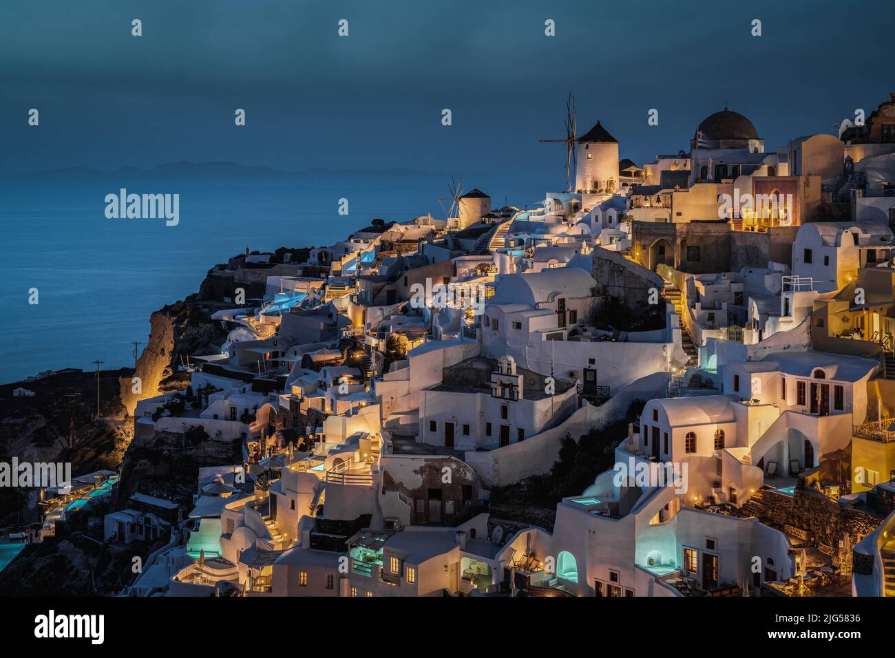 Scenic blue hour at Oia, the most typical village of Santorini and popular honeymoon destination, Greece Stock Photo
