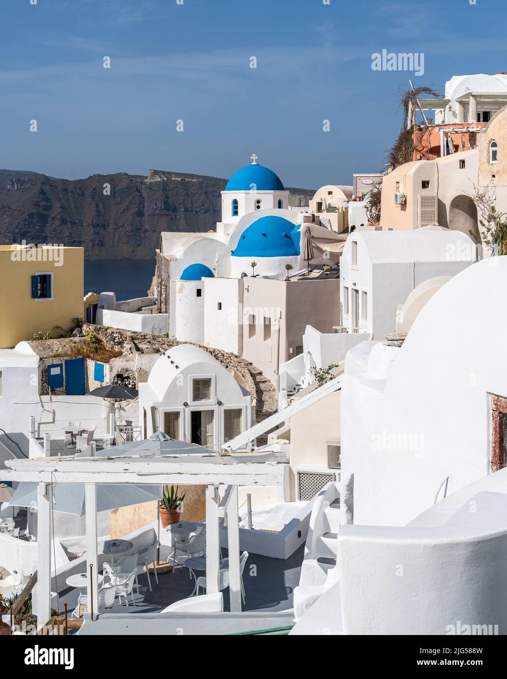 View of Oia village in Santorini with traditional white houses and blue ...