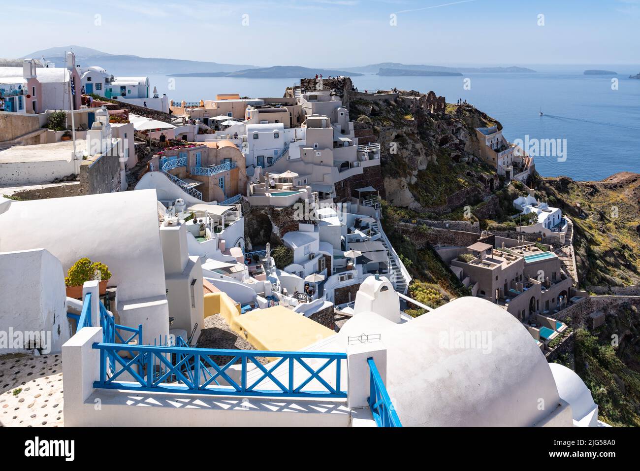 Panoramic view of Oia with the castle dominating the village, Santorini, Greece Stock Photo