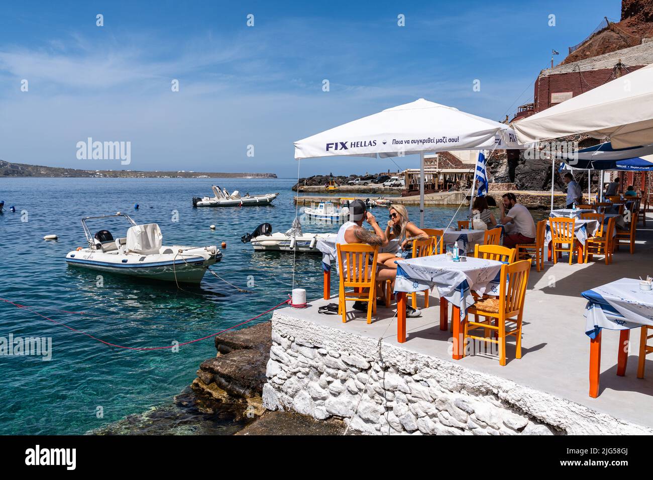 Santorini, Oia, Greece, Apr. 22 - Typical fish restaurant along the sea at Ammoudi Bay Stock Photo