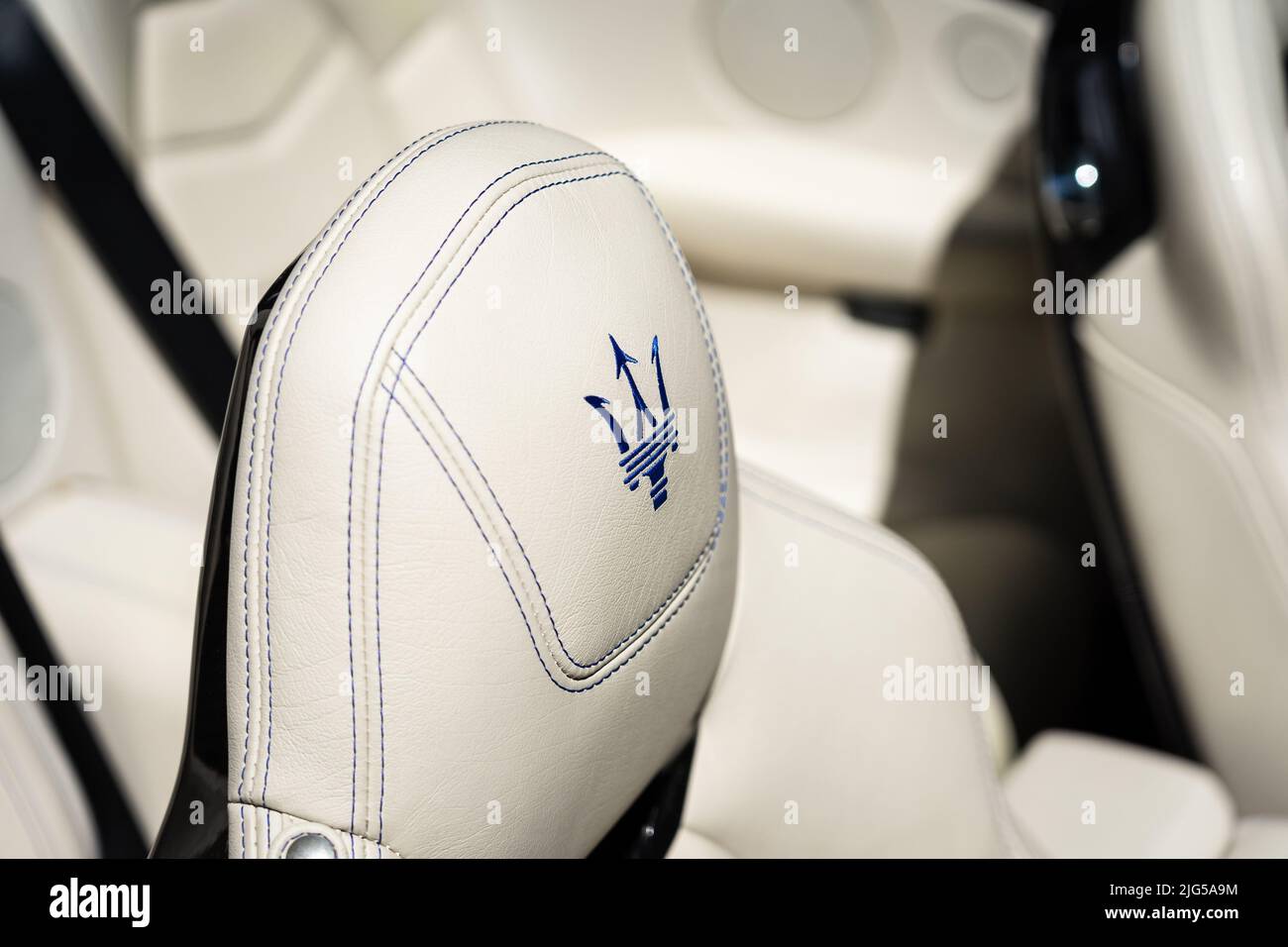 BERLIN - JUNE 18, 2022: Embroidered emblem on the headrest of the Maserati GranCabrio Sport. Classic Days Berlin. Stock Photo