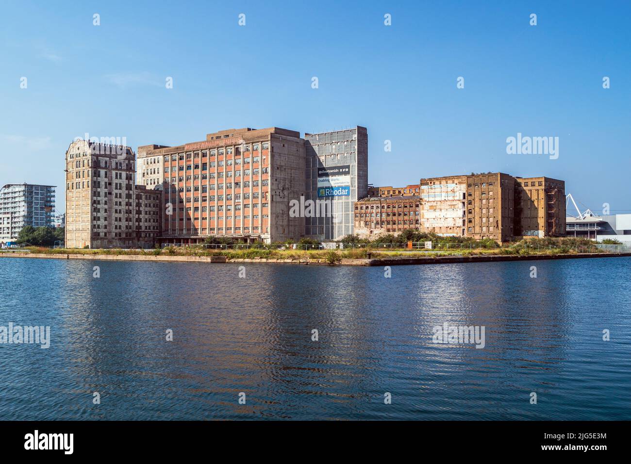 View over Royal Victoria Dock towards the Millennium Mills, derelict