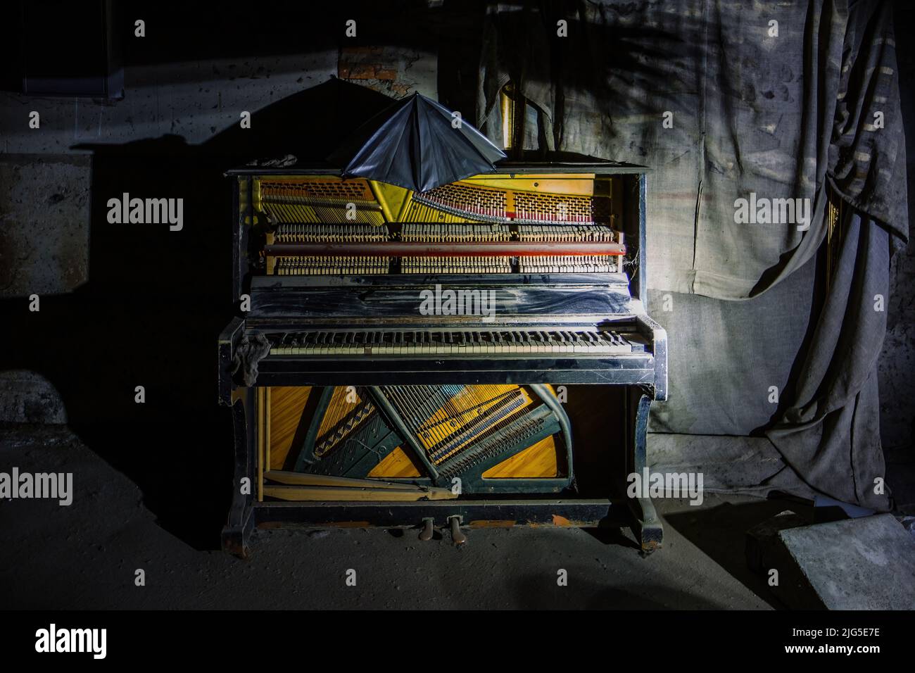Old broken piano in dark room Stock Photo Alamy
