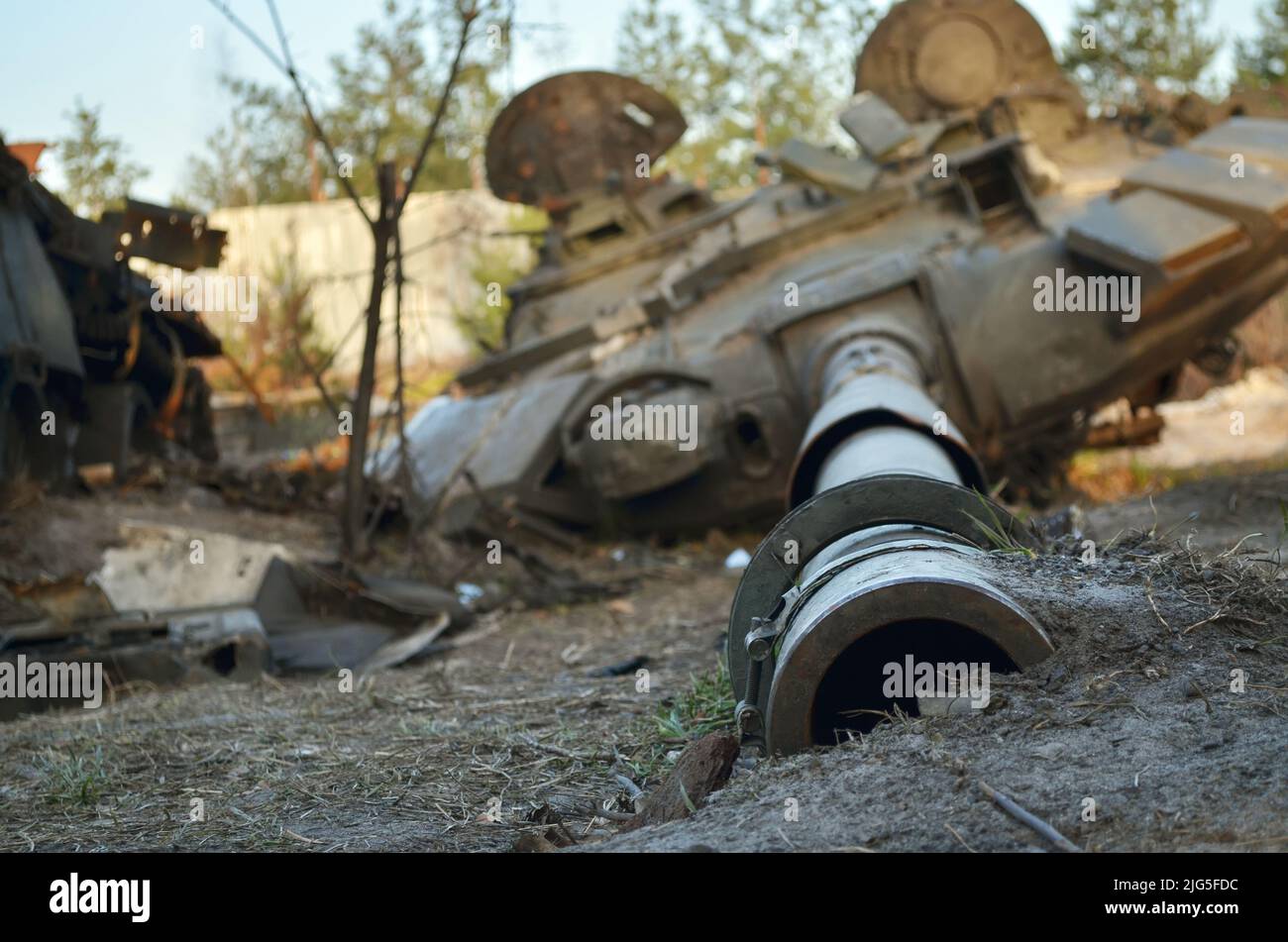 Close-up of the tank gun of the destroyed military equipment of the Russian army following the Ukrainian force's counter-attacks in the Kiev region. Stock Photo