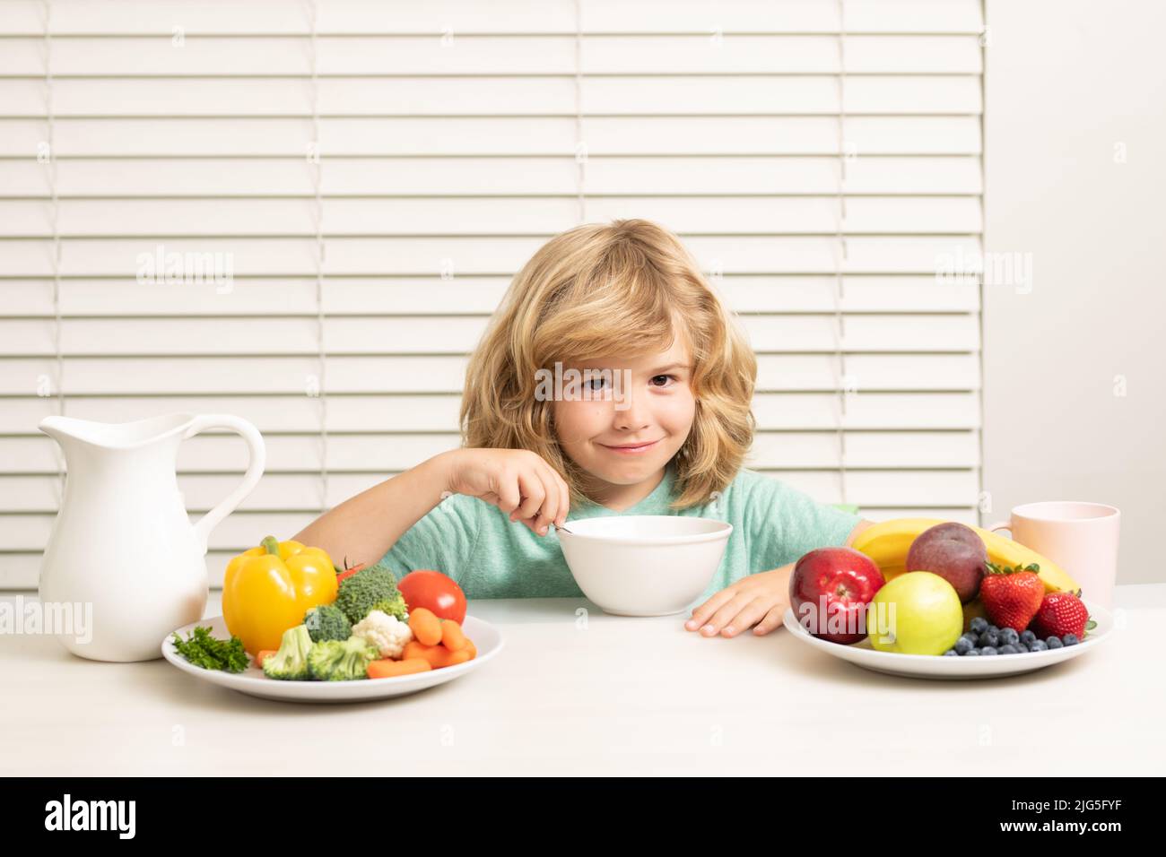 Morning snack with muesli cereal granola. Child boy eating organic healthy food. Healthy