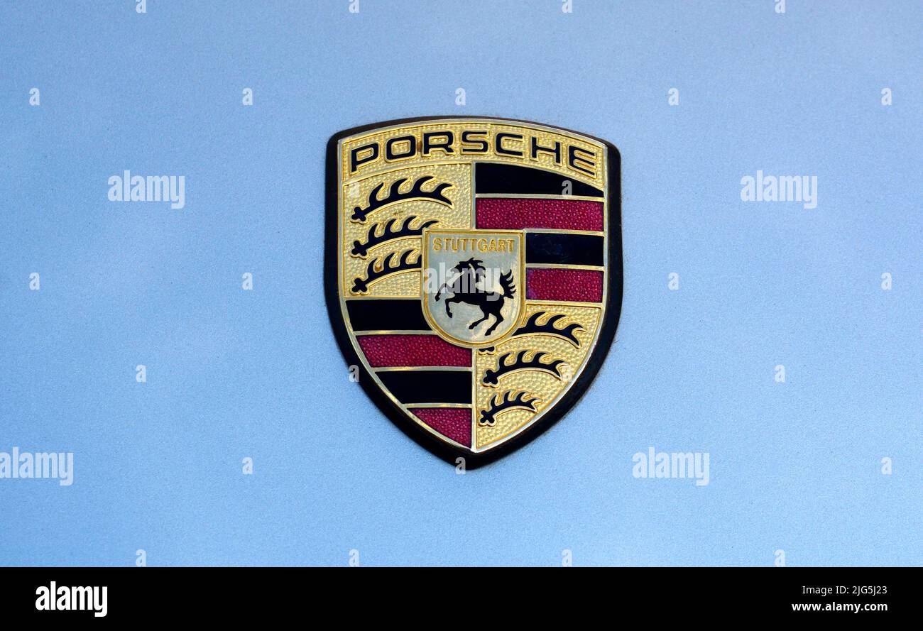 A vintage Porsche Stuttgart hood crest or emblem on a Porsche on display at a car show in Santa Fe, New Mexico. Stock Photo