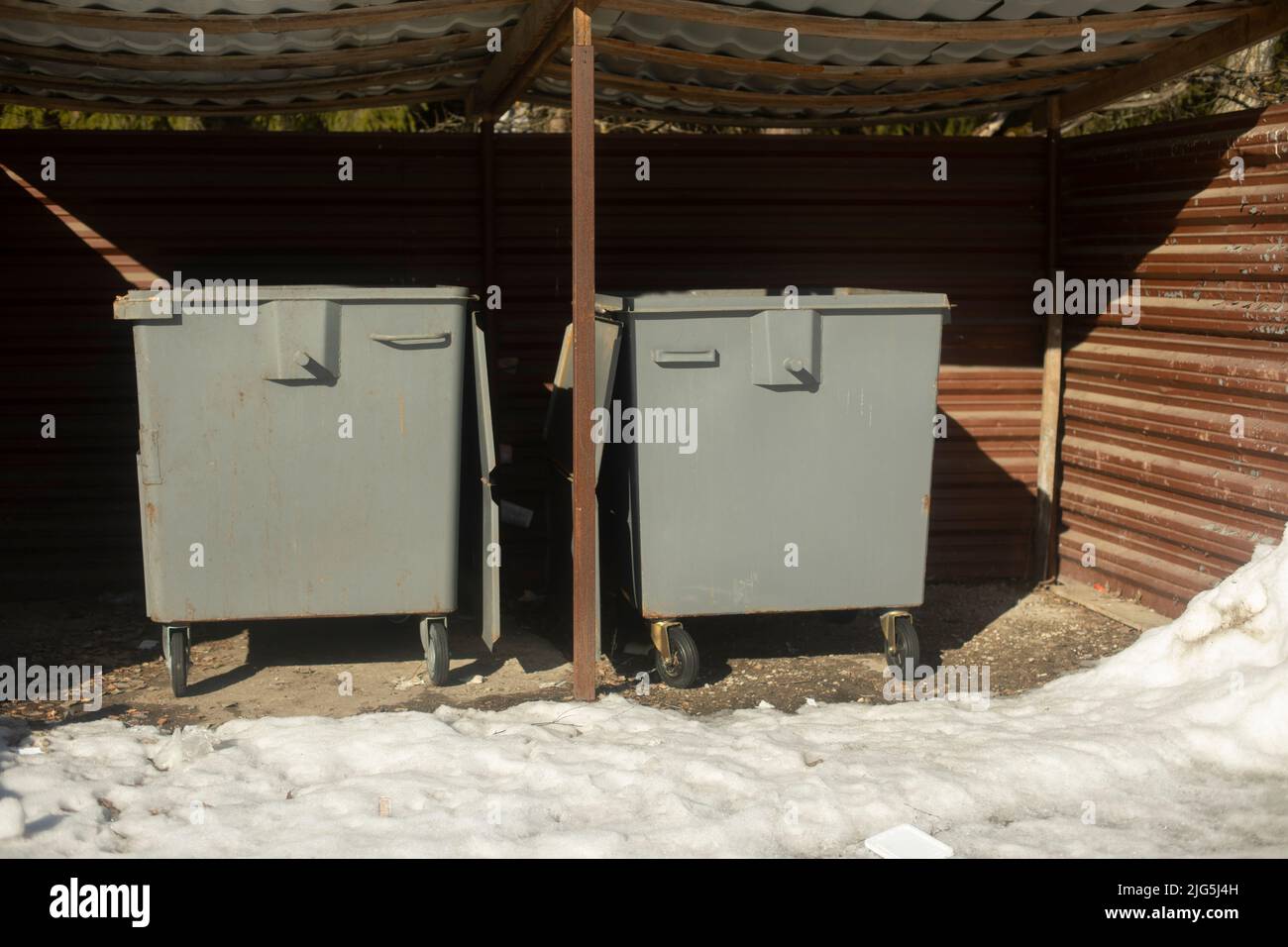 Garbage cans are gray. Place to dump waste. Garbage at store Stock