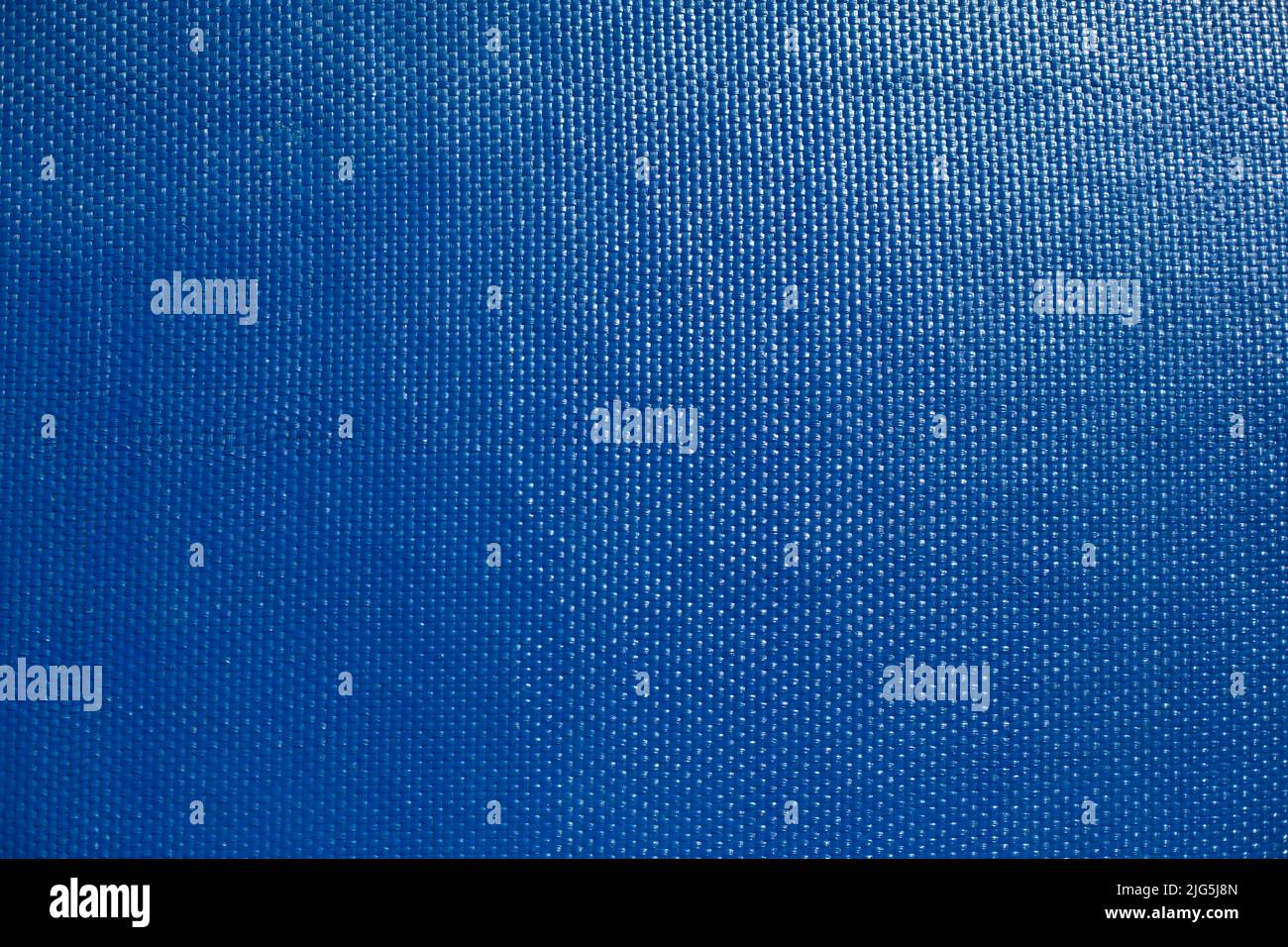 Blue texture. Fine texture of surface of painted board. Lots of points. Glare on board. Stock Photo
