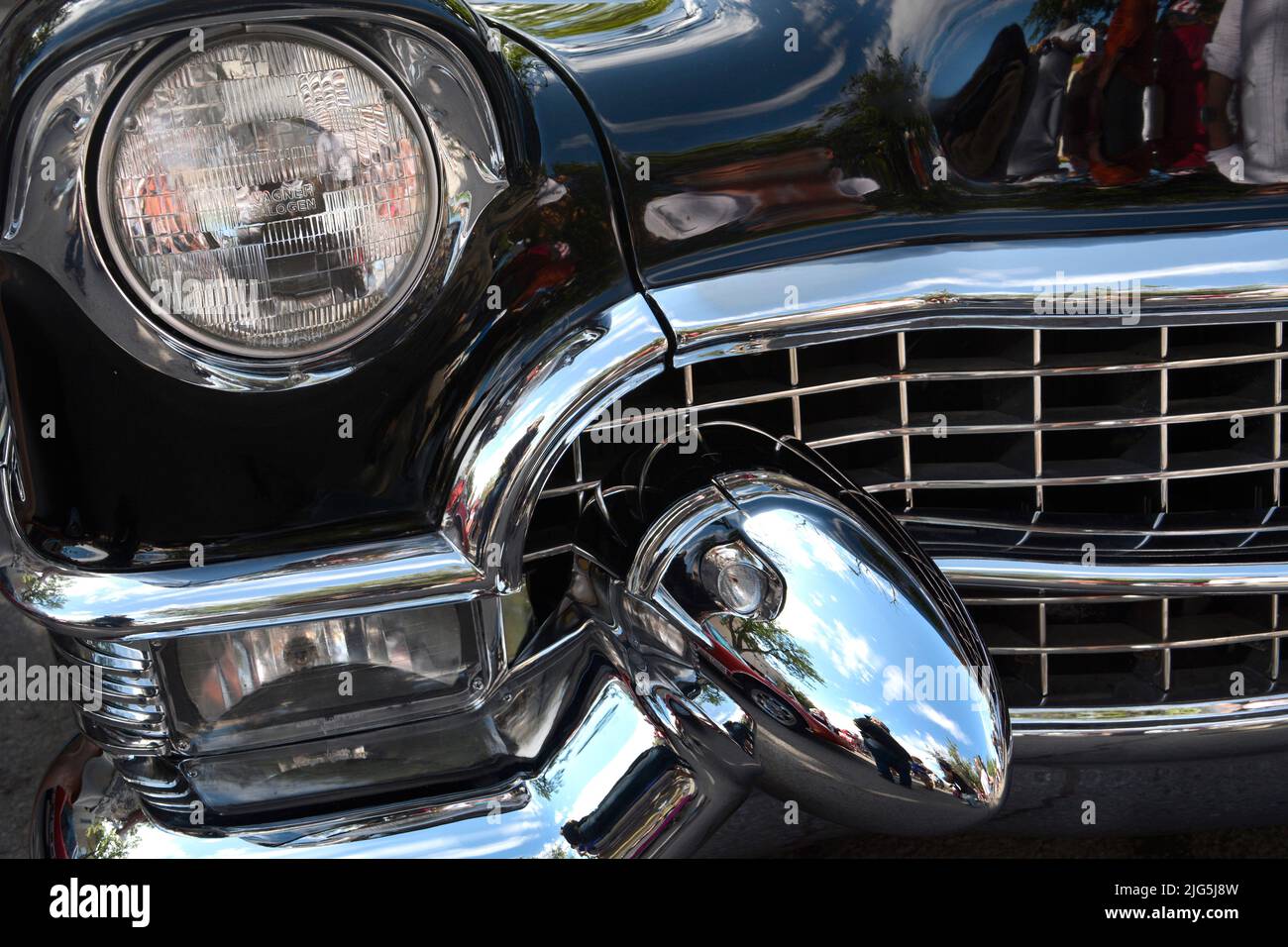 A black 1955 Cadillac El Dorado on display at a car show in Santa Fe