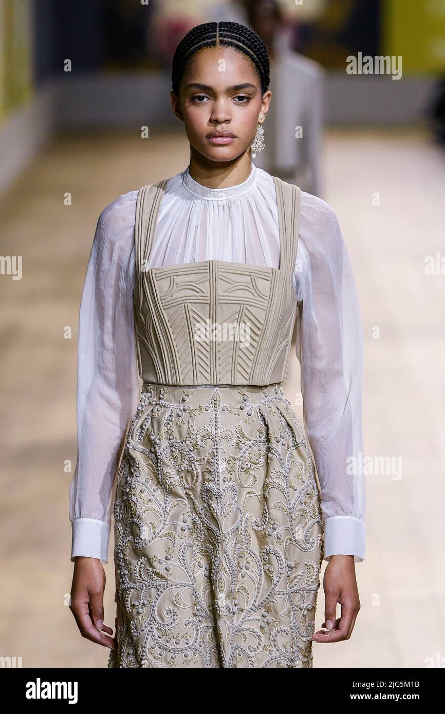 Christian Dior Paris Haute Couture Autumn Winter Model wearing a flolength  charcoal strapless evening dress a sculpted skirt Stock Photo - Alamy