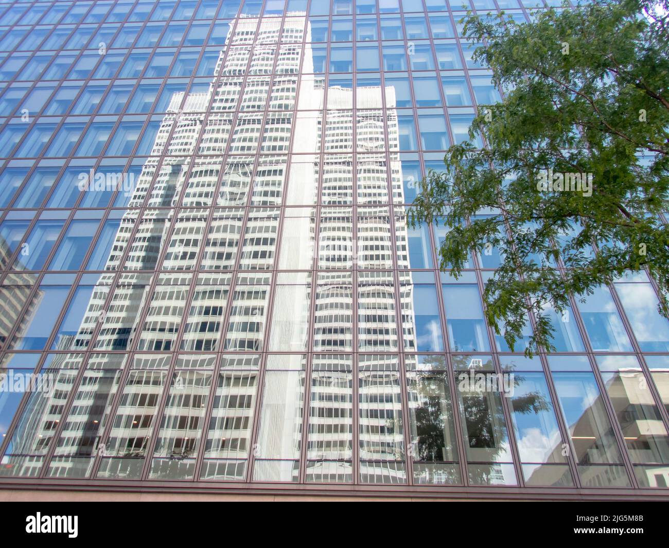 Reflected view of Place VilleMarie on the next building's windows