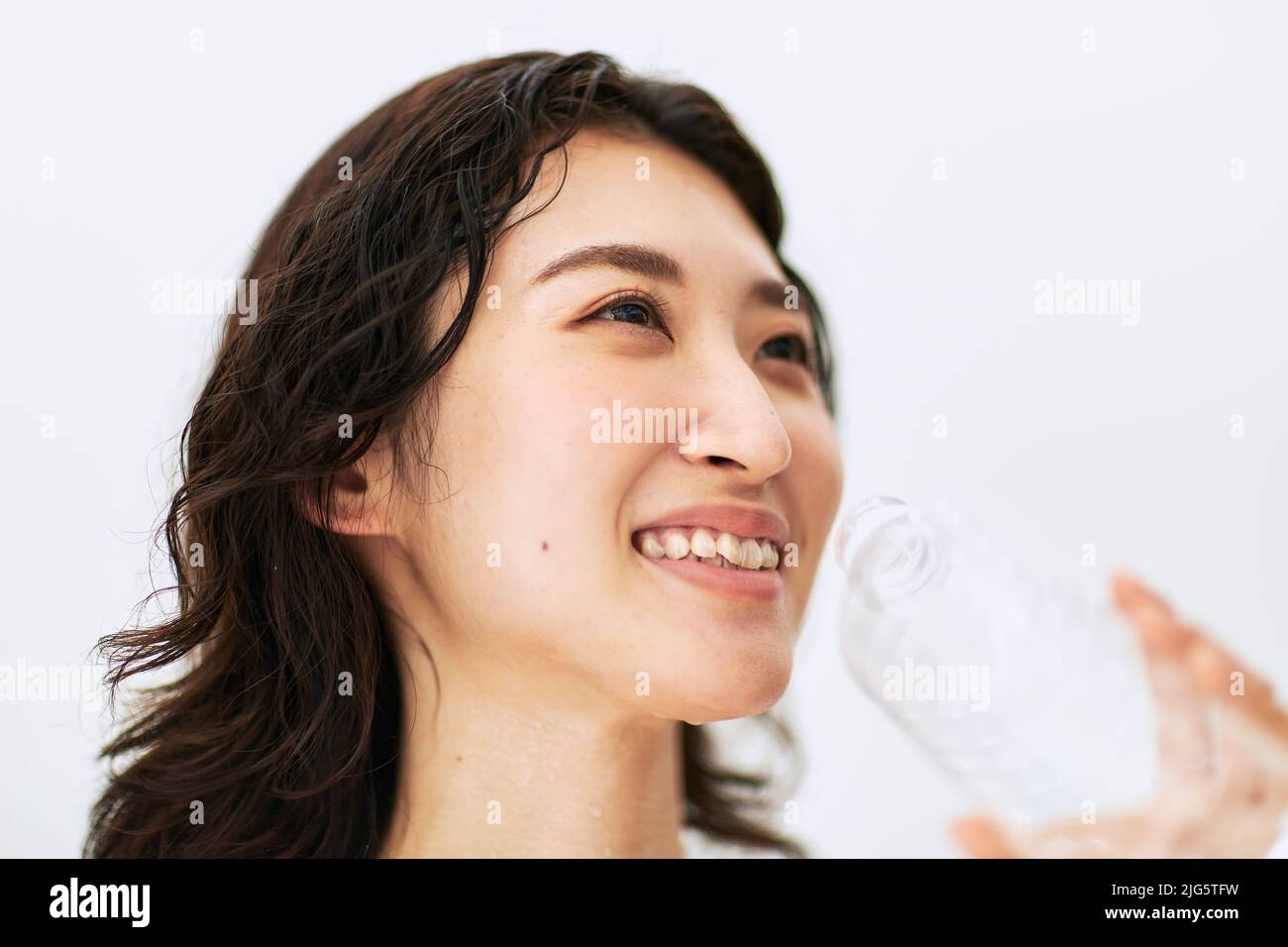Japanese woman drinking water Stock Photo Alamy