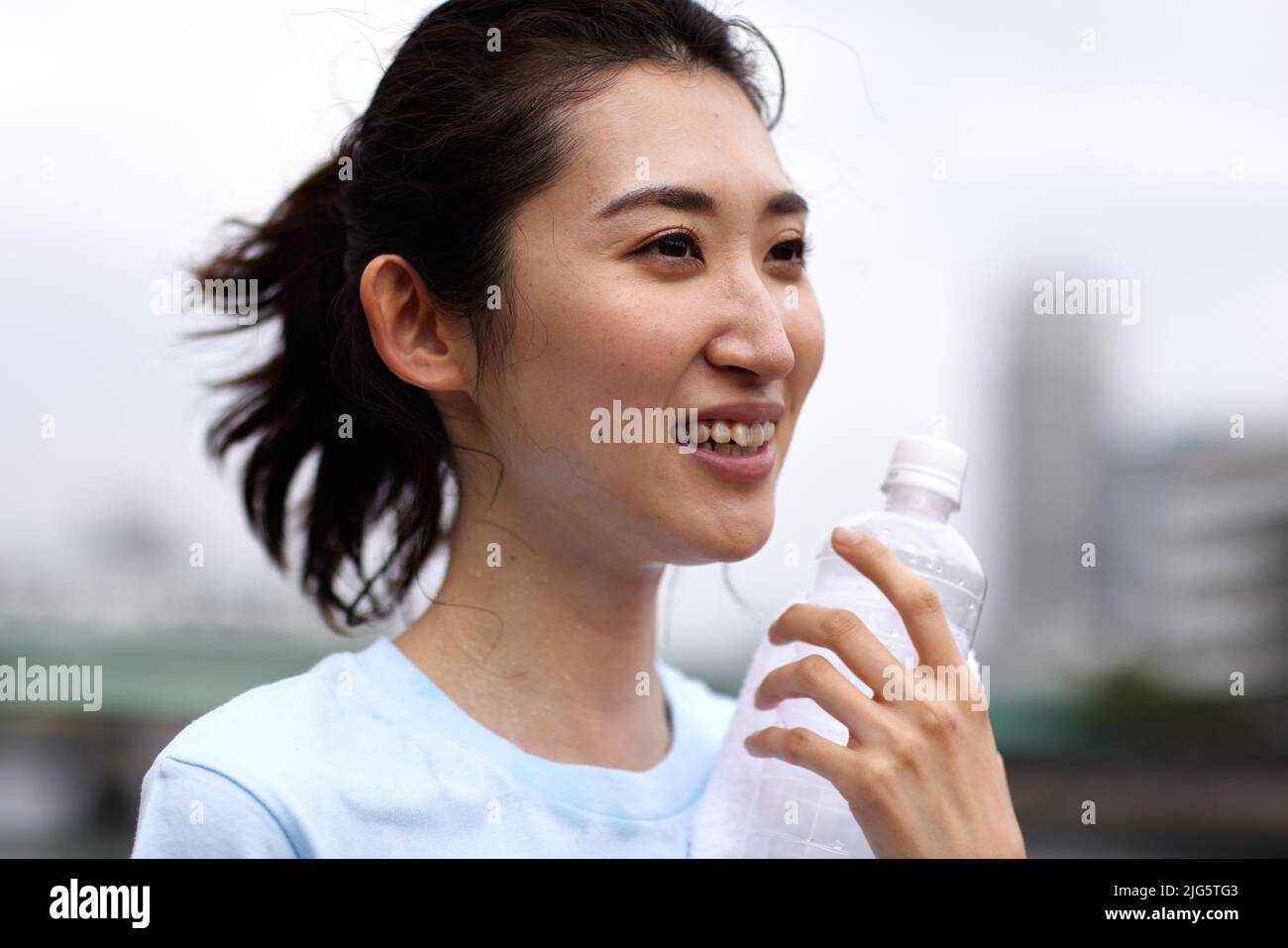 Japanese woman drinking water Stock Photo Alamy