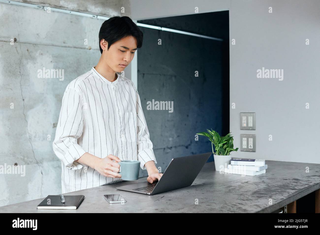 Japanese Man Using Computer Japanese man working with laptop Stock Photo - Alamy