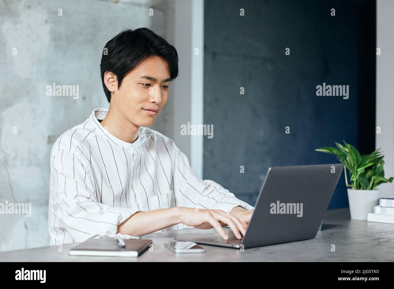 Japanese Man Using Computer Japanese man working with laptop Stock Photo - Alamy