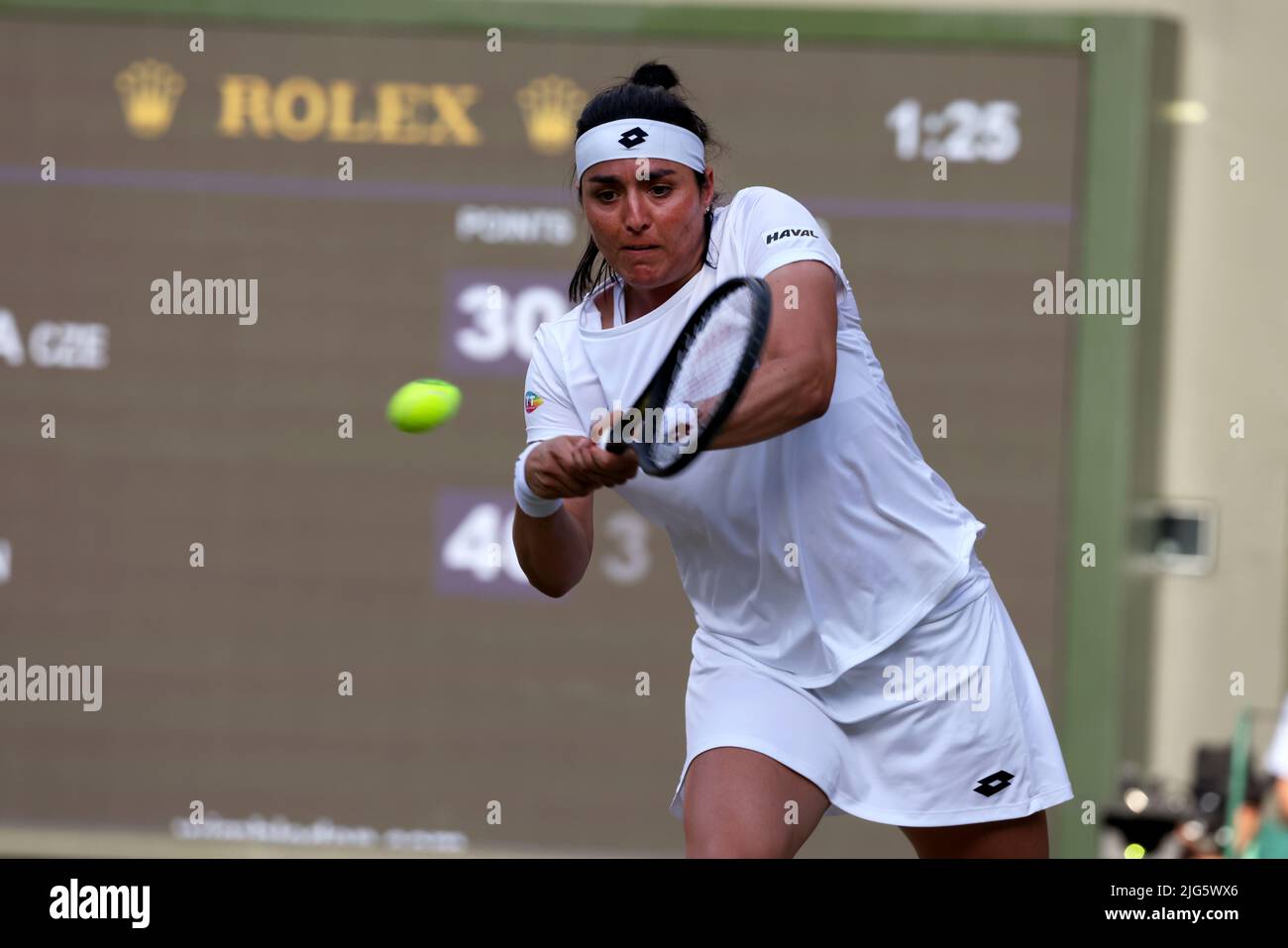 5 July 2022, All England Lawn Tennis Club, Wimbledon, London, United Kingdom:  Tunisia's Ons Jabeur strikes a backhand return to Marie Bouzkova of the Czech Republic during their quarterfinal match at Wimbledon today.  Jabeur won the match to advance to the semi finals. Stock Photo