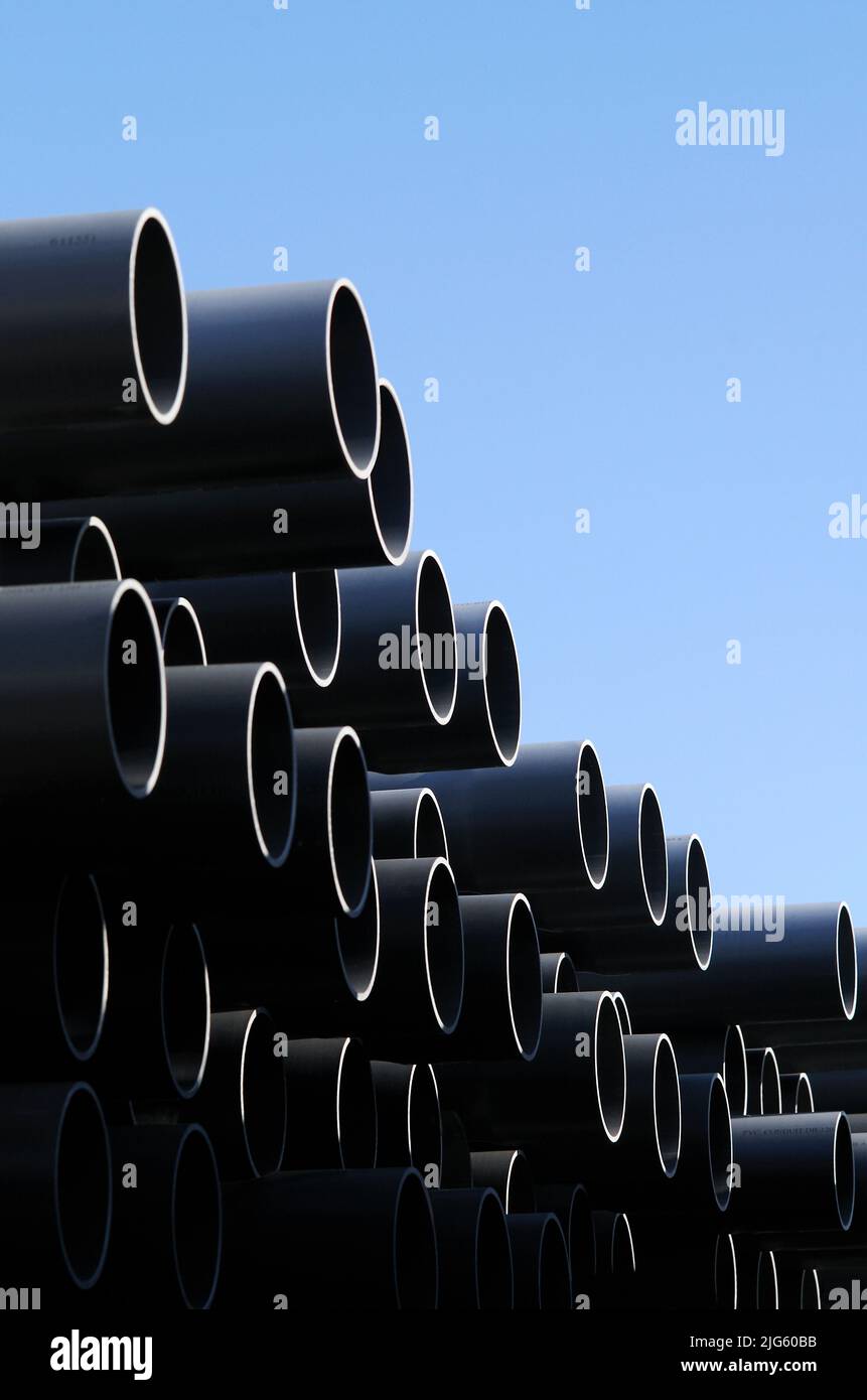 A stack of PVC conduit Stock Photo