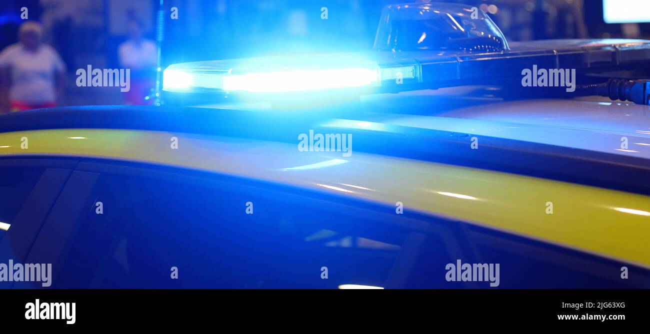 flashing blue of the police car during the protest in the city Stock Photo Alamy
