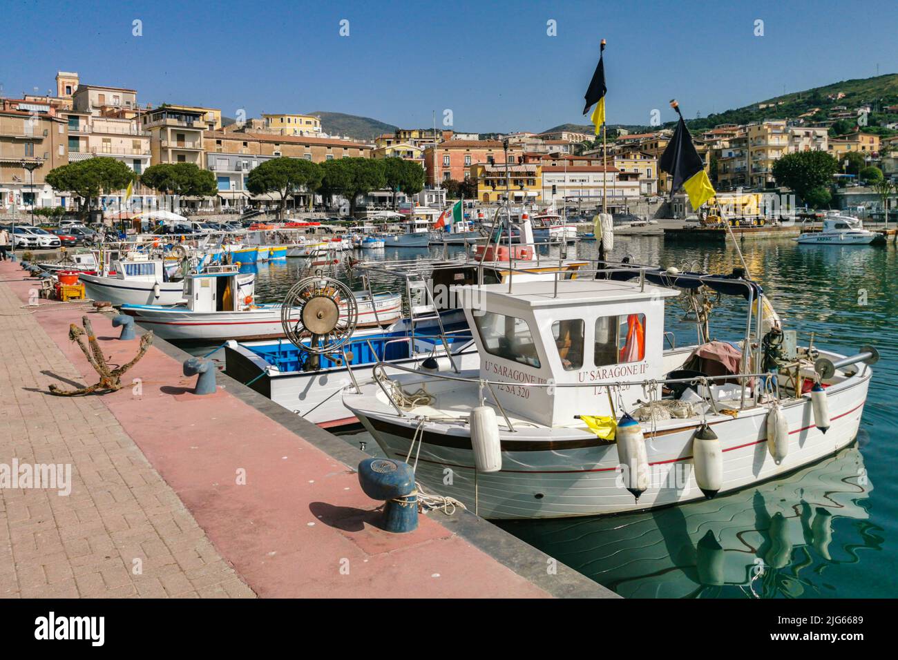 Colorful fishing boats moored at Marina di Camerota port. Marina di Camerota, Campania, Italy, June 2022 Stock Photo